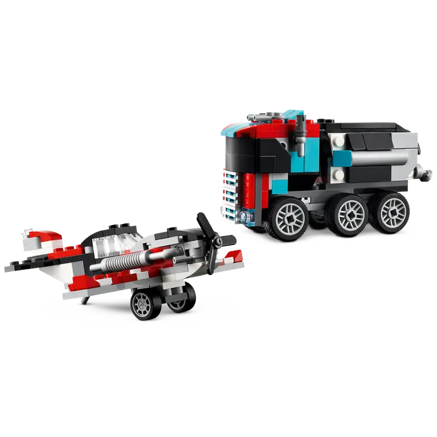 A toy airplane and a truck made of colorful blocks are on a white surface. The airplane has red, black, and white parts.