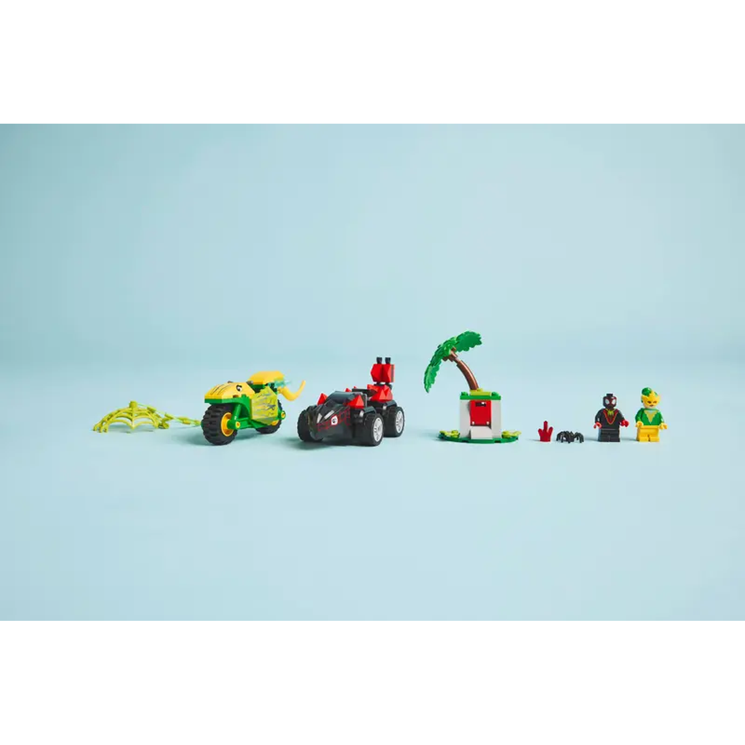 Lego set on blue background: motorcycle, car, palm tree, figures. Green, red, black, yellow colors.
