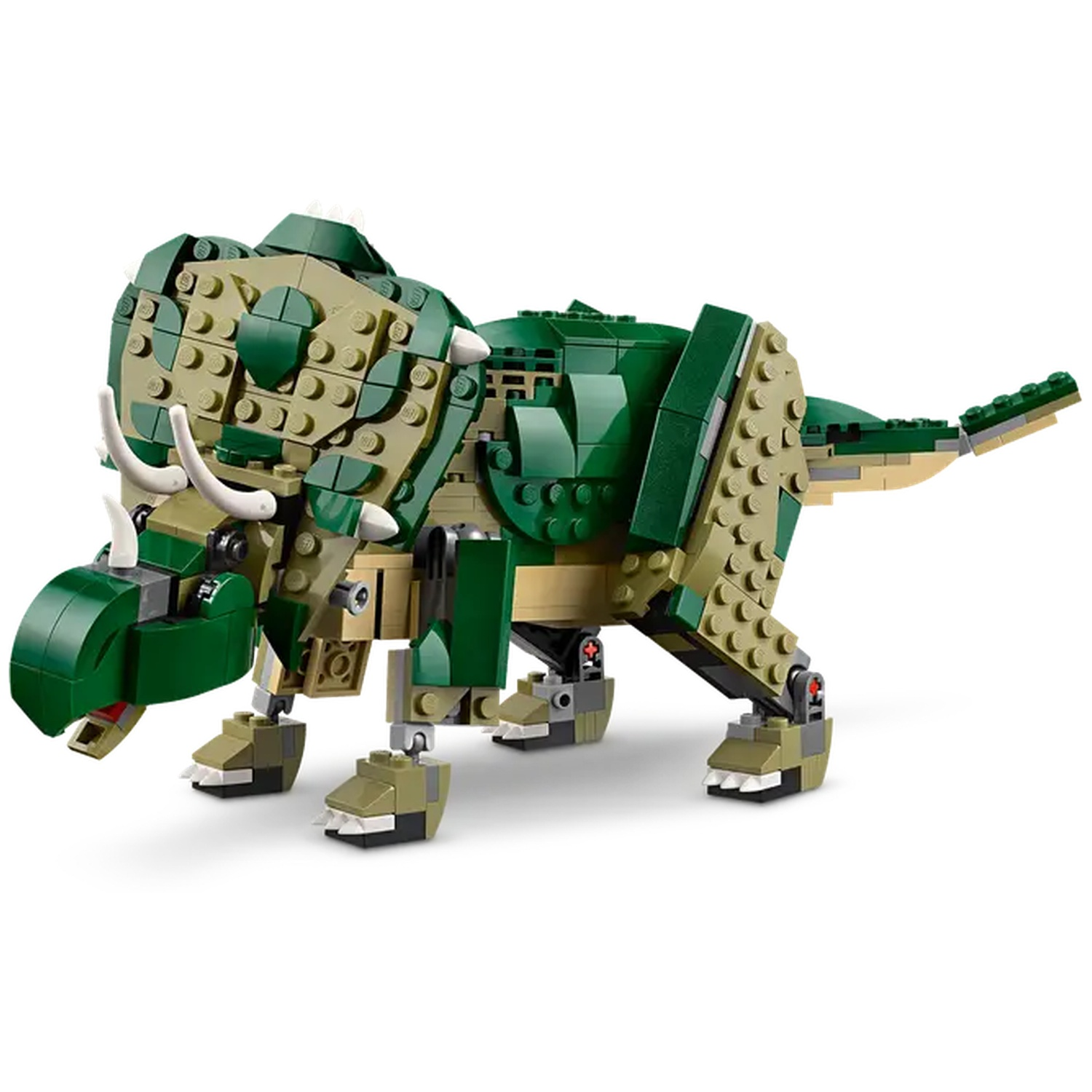 A Lego Triceratops is shown, built with green and tan blocks. It has horns, a frill, and is standing on a white surface.