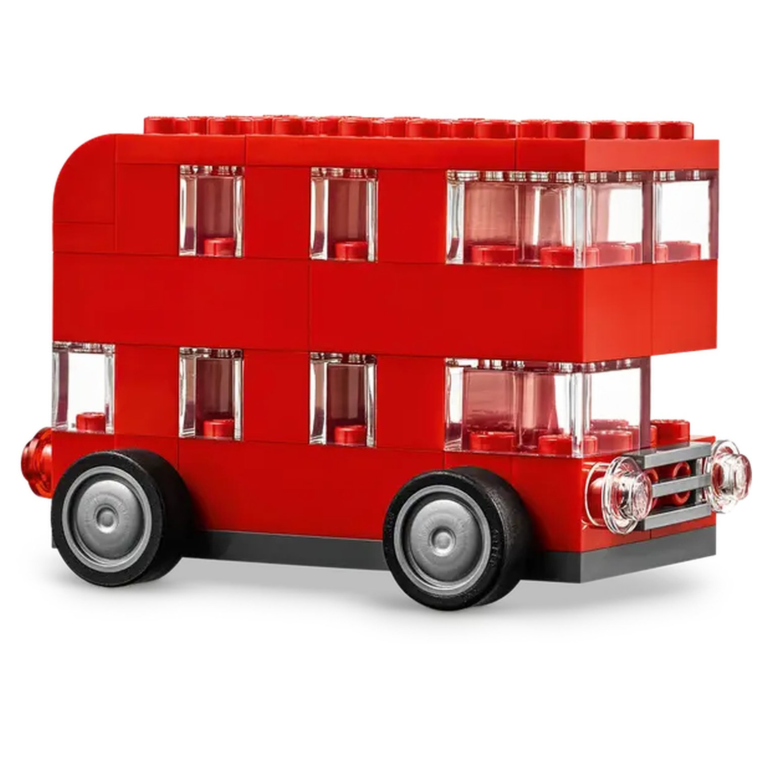 Un jouet de bus à impériale rouge fait de blocs. Il a des roues, des fenêtres et des phares. Le fond est blanc.