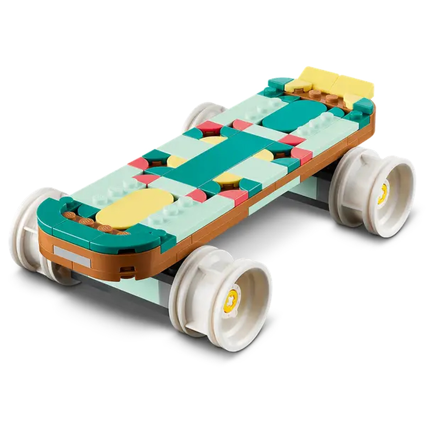 A Lego car, with green, brown, yellow and white blocks. It has four white wheels and is on a white background.
