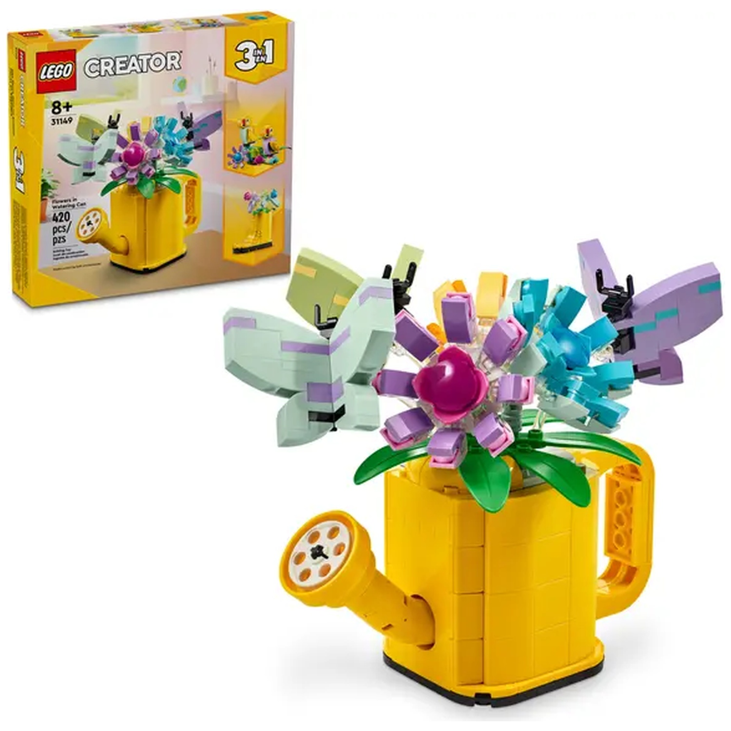 A Lego set of flowers in a yellow watering can. The box is on the left. Flowers are purple, blue, and green.