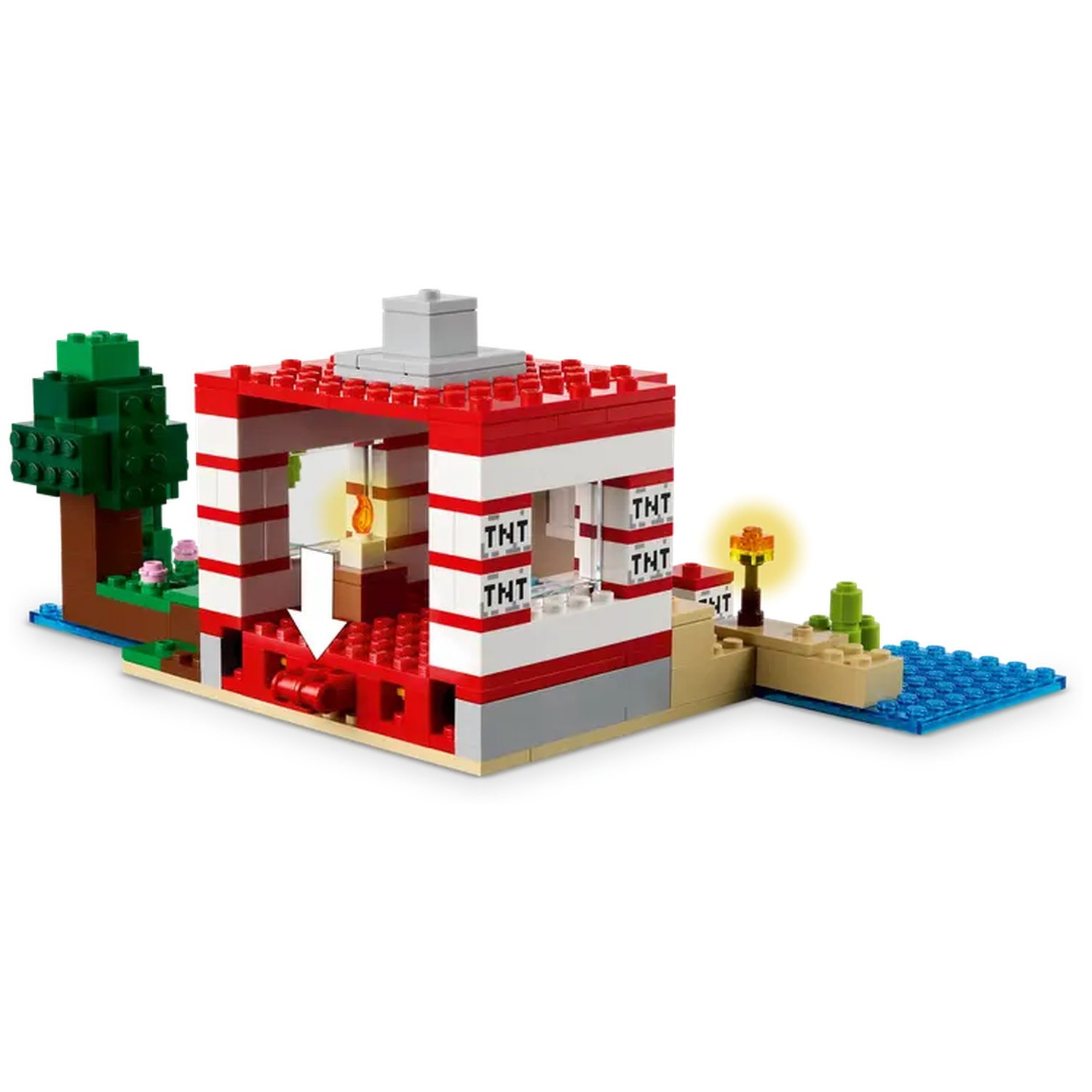 Un ensemble LEGO Minecraft avec un bâtiment rouge et blanc, un arbre, de l'eau et des blocs TNT.