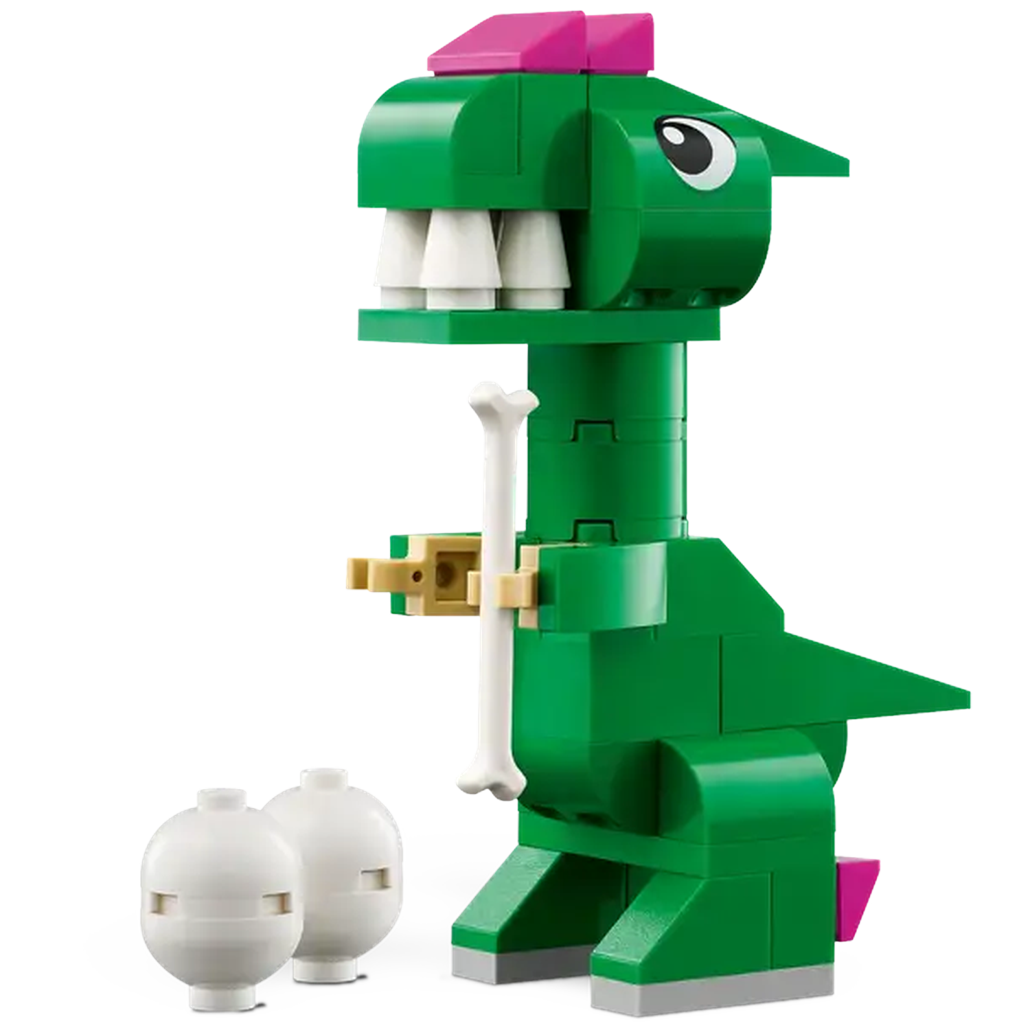 A green Lego dinosaur with a bone, pink accents, and white teeth. Two white spherical Lego pieces are in front.