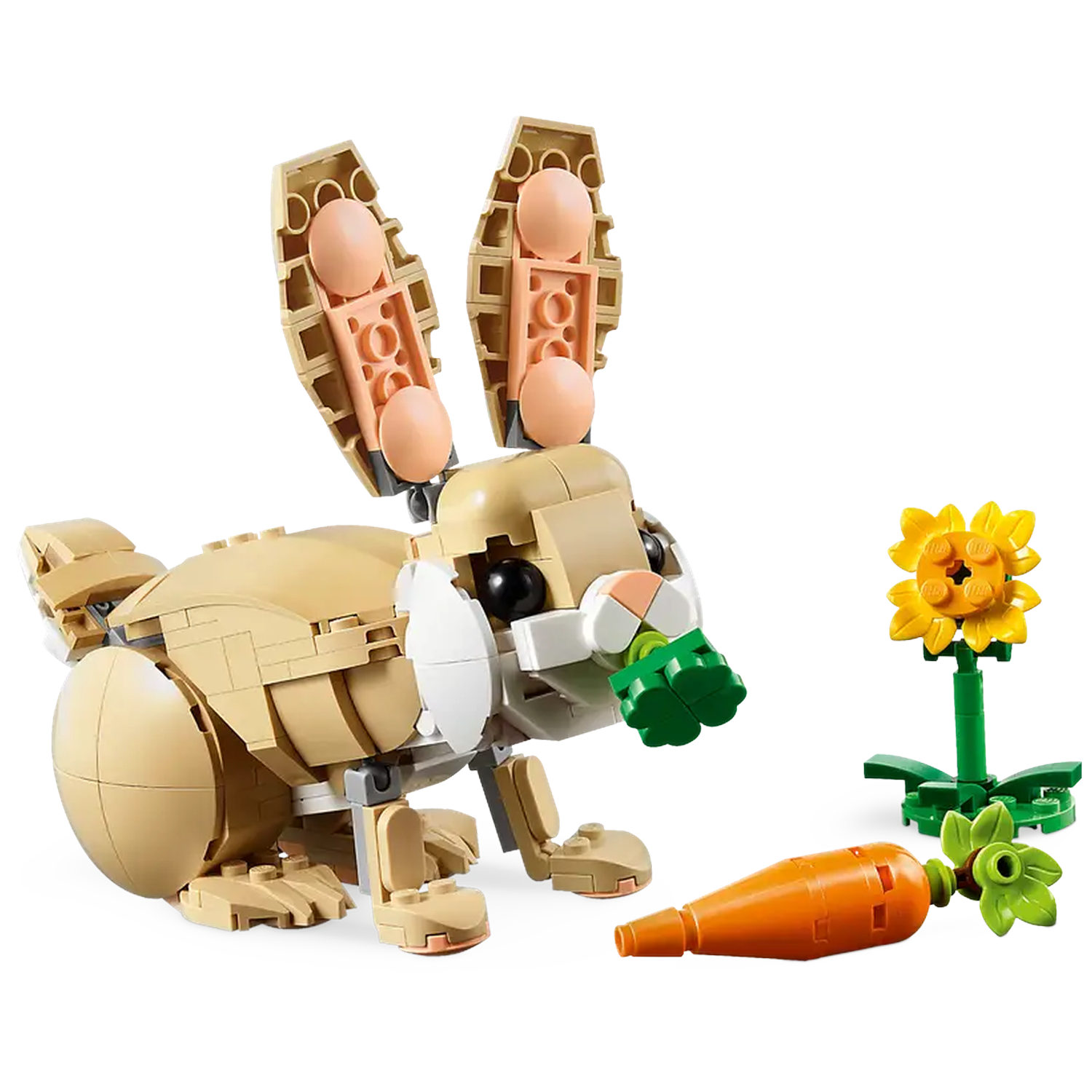 A Lego bunny with a green leaf in its mouth, next to a carrot and a sunflower.