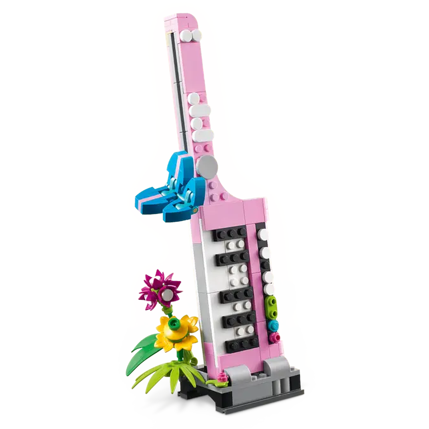A pink Lego musical instrument with blue accents and flowers. The instrument has black and white keys and is set on a white background.