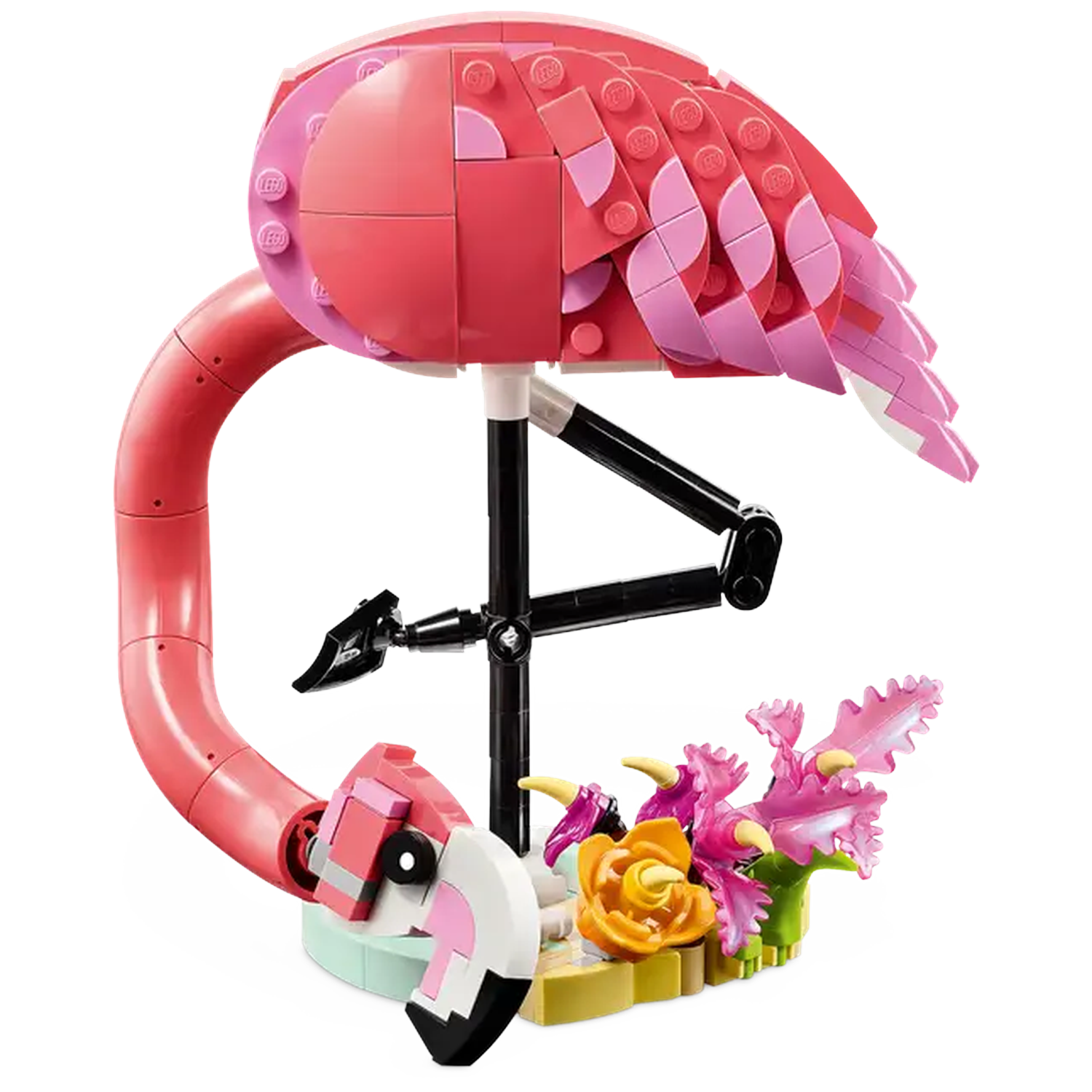 A Lego flamingo with pink and white feathers, a curved neck, black legs, and a small flower arrangement at its base.