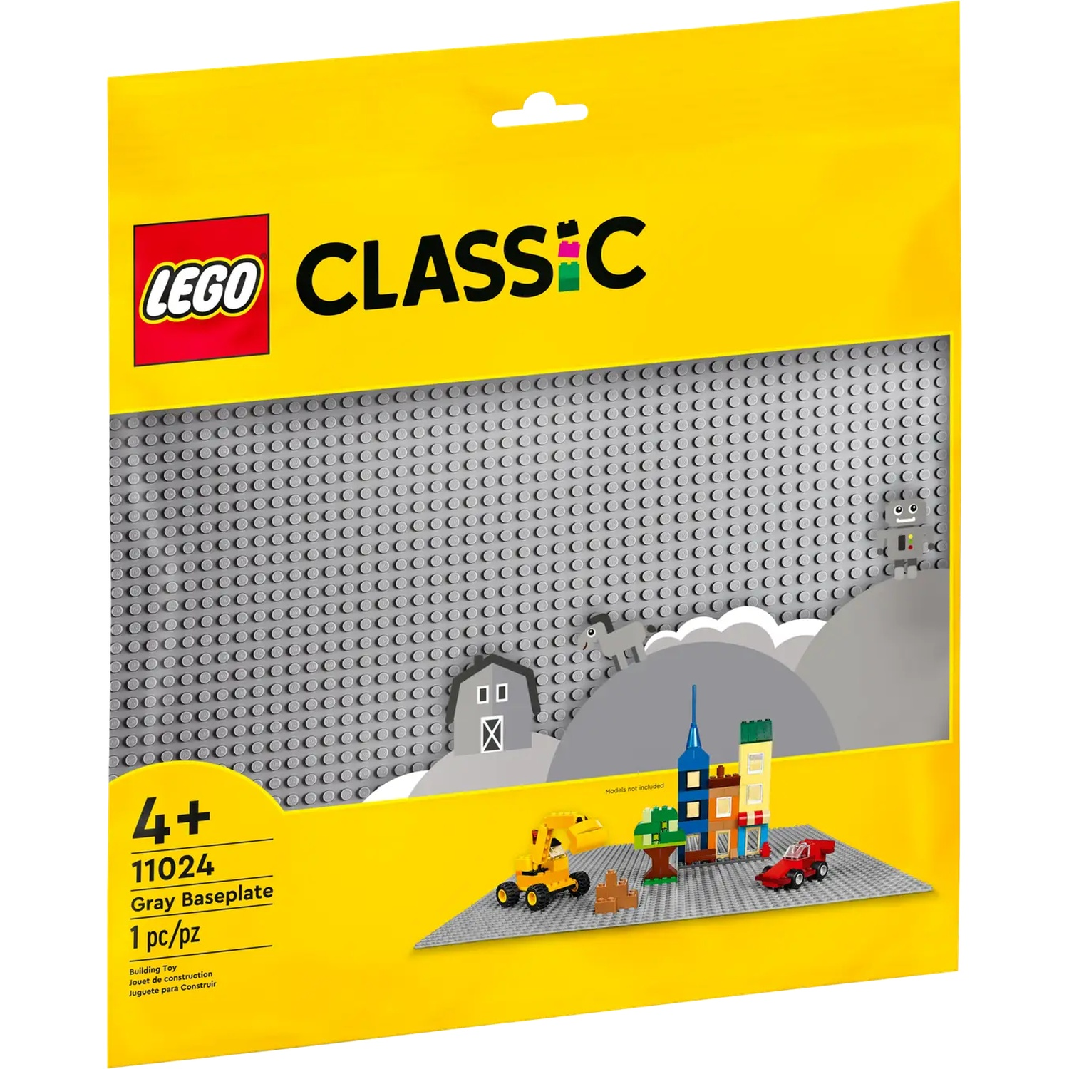 Een gele LEGO Classic verpakking met een grijze basisplaat, met een kleine LEGO stad scène met gebouwen, voertuigen en een boom.