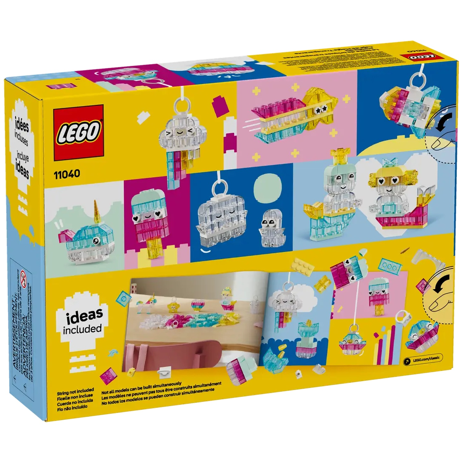 Une boîte Lego montre diverses créations Lego. La boîte est jaune et porte le logo Lego. Elle comprend des modèles comme un narval et une étoile.