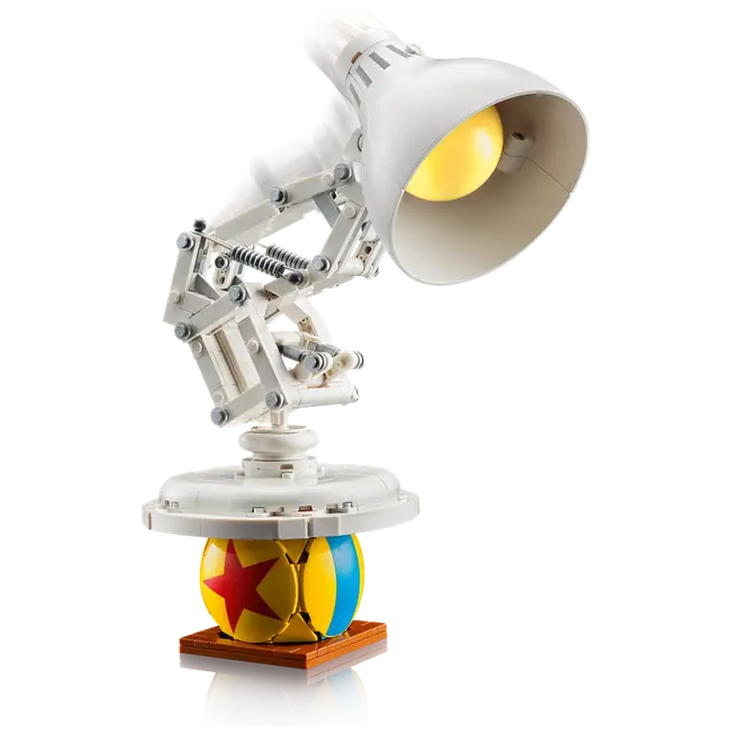 A Lego lamp with a yellow light, white body, and a ball base. The ball has a red star, blue stripe, and yellow background.