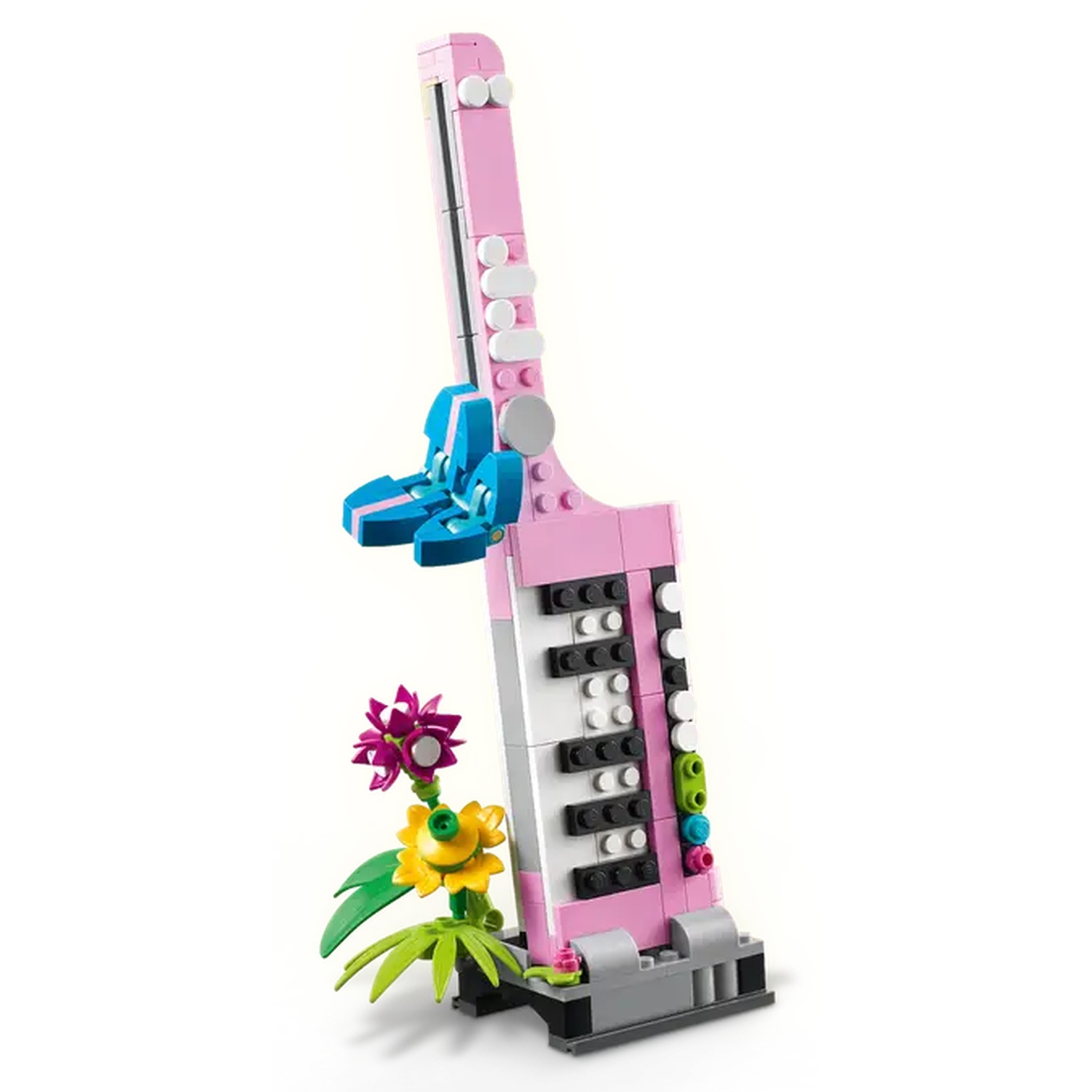 Een Lego-gebouwd roze en wit muziekinstrument met blauwe accenten en een klein bloemstuk ervoor.