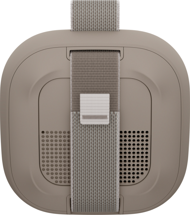 Draufsicht auf ein VR-Headset. Beige Farbe mit grauen Stoffriemen. Perforierte Lautsprecherbereiche an den Seiten. Verstellbare Schnalle.