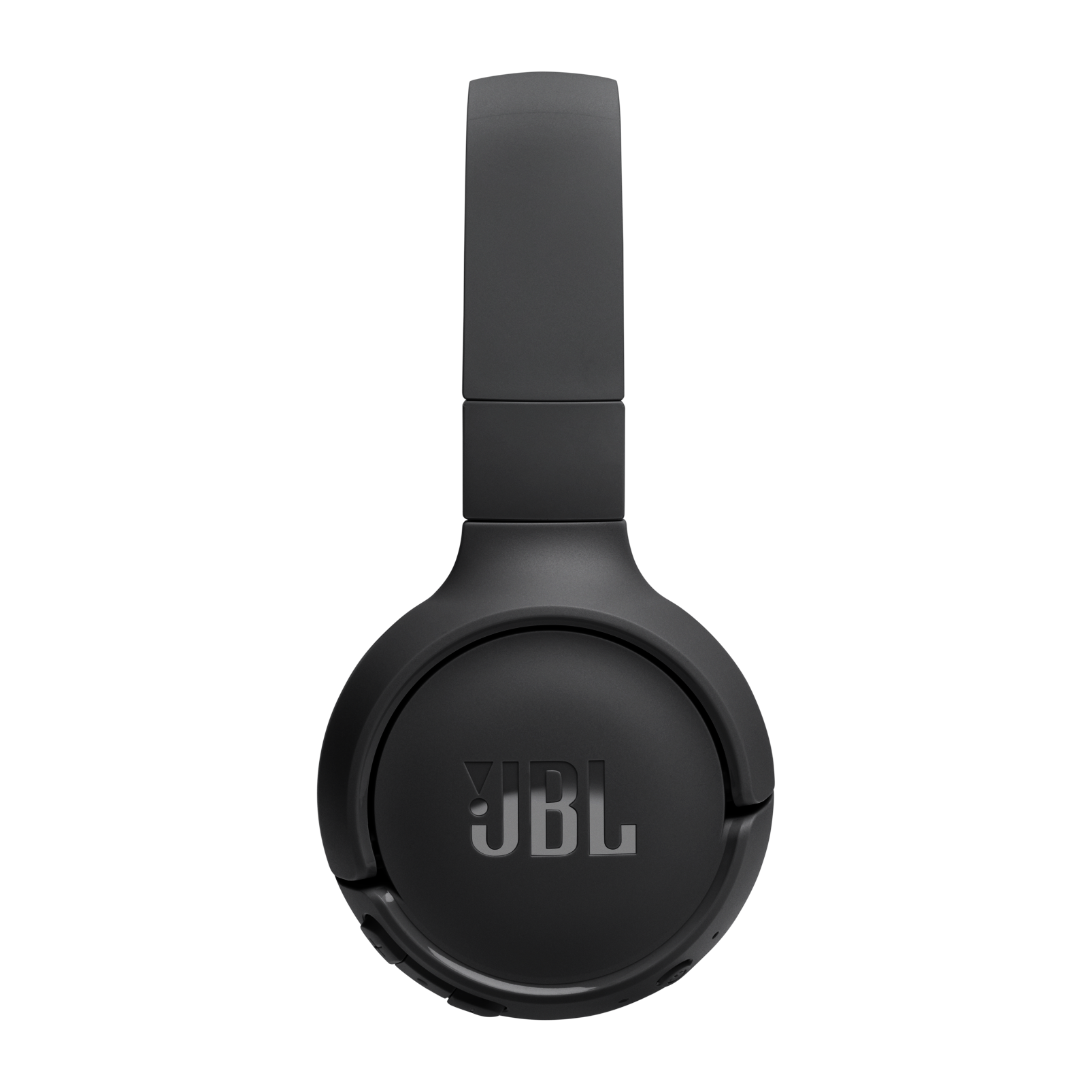 Siyah JBL kulaklıklar ortalanmış, markanın logosunu gösteriyor. Arka plan dokulu, gri bir yüzey.