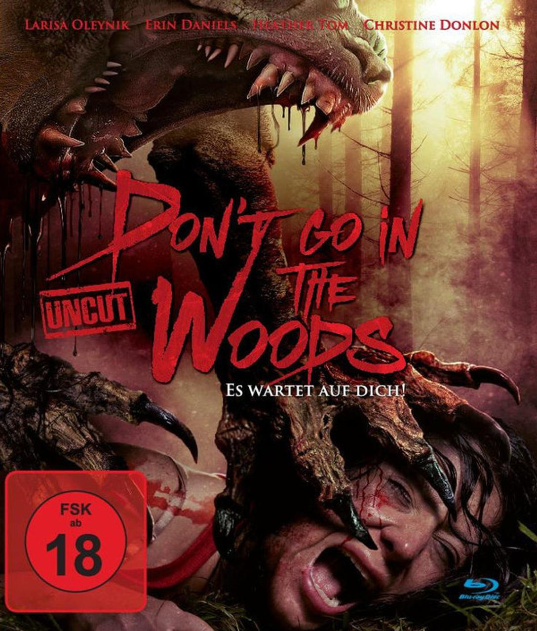 Filmposter: Ein Monster greift eine schreiende Frau an. Der Titel 'Don't Go in the Woods' und eine rote '18'-Bewertung sind sichtbar.