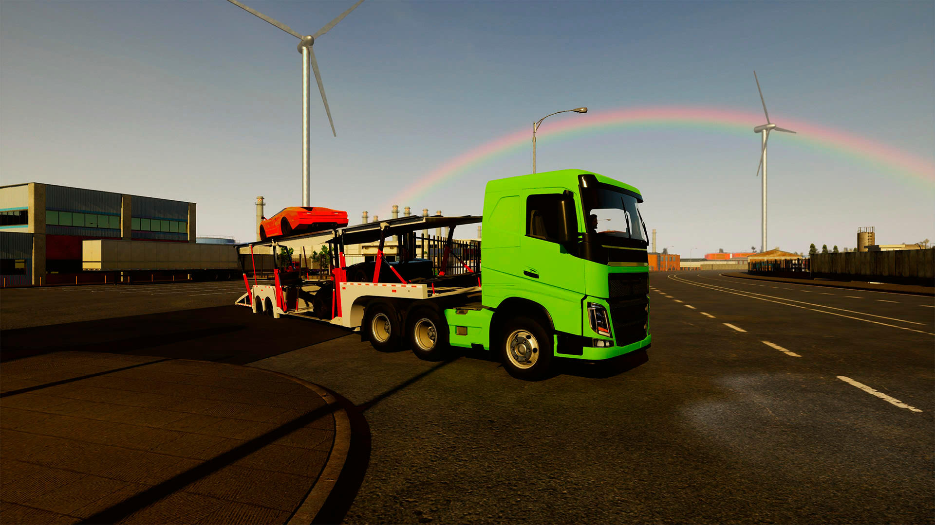 Ein grüner Lkw mit einem roten Auto auf einem Anhänger. Regenbogen am Himmel, Windräder im Hintergrund. Industrielle Umgebung.