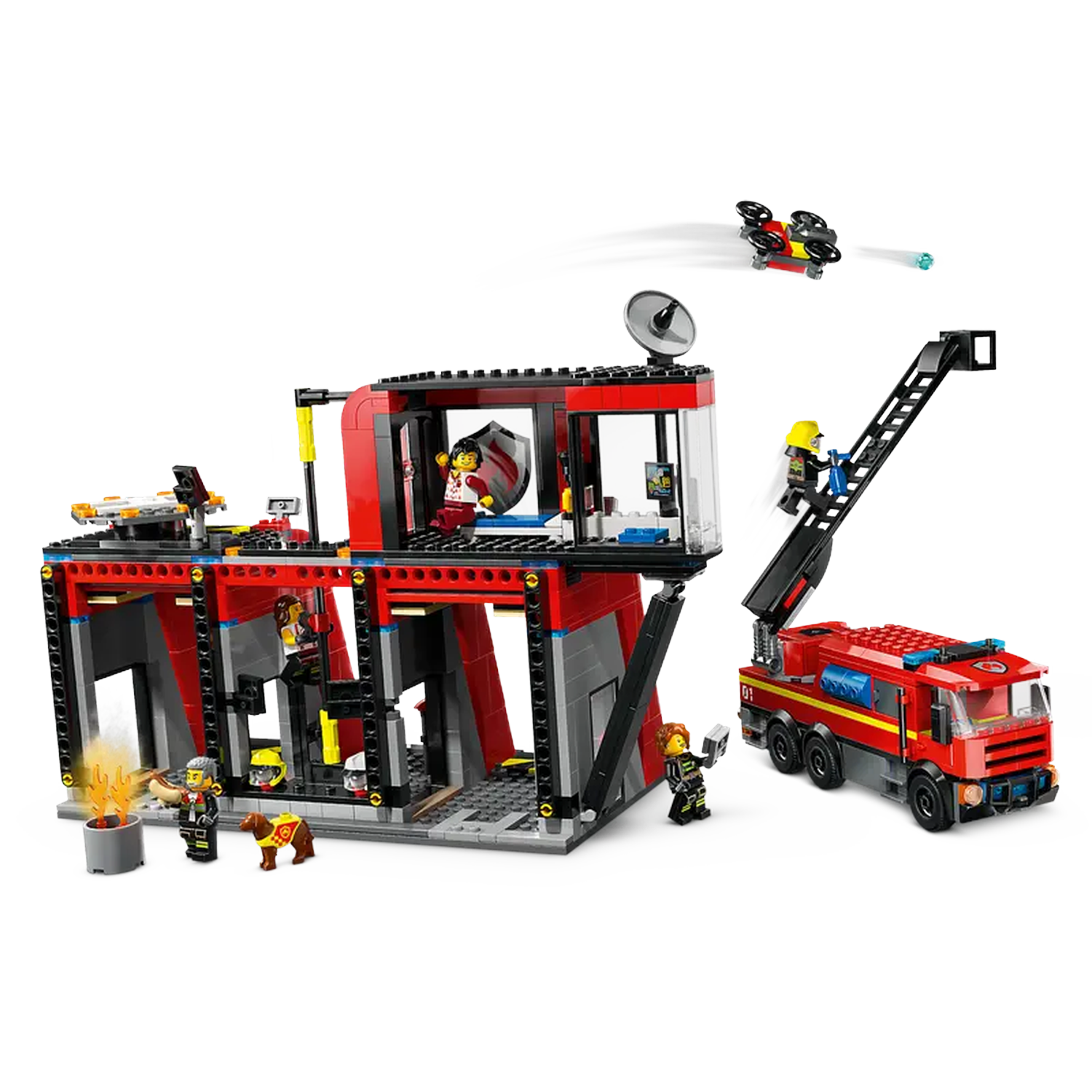 Lego fire station with figures, fire truck, drone, and dog. Flames are visible. Figures are on a ladder and inside the building.