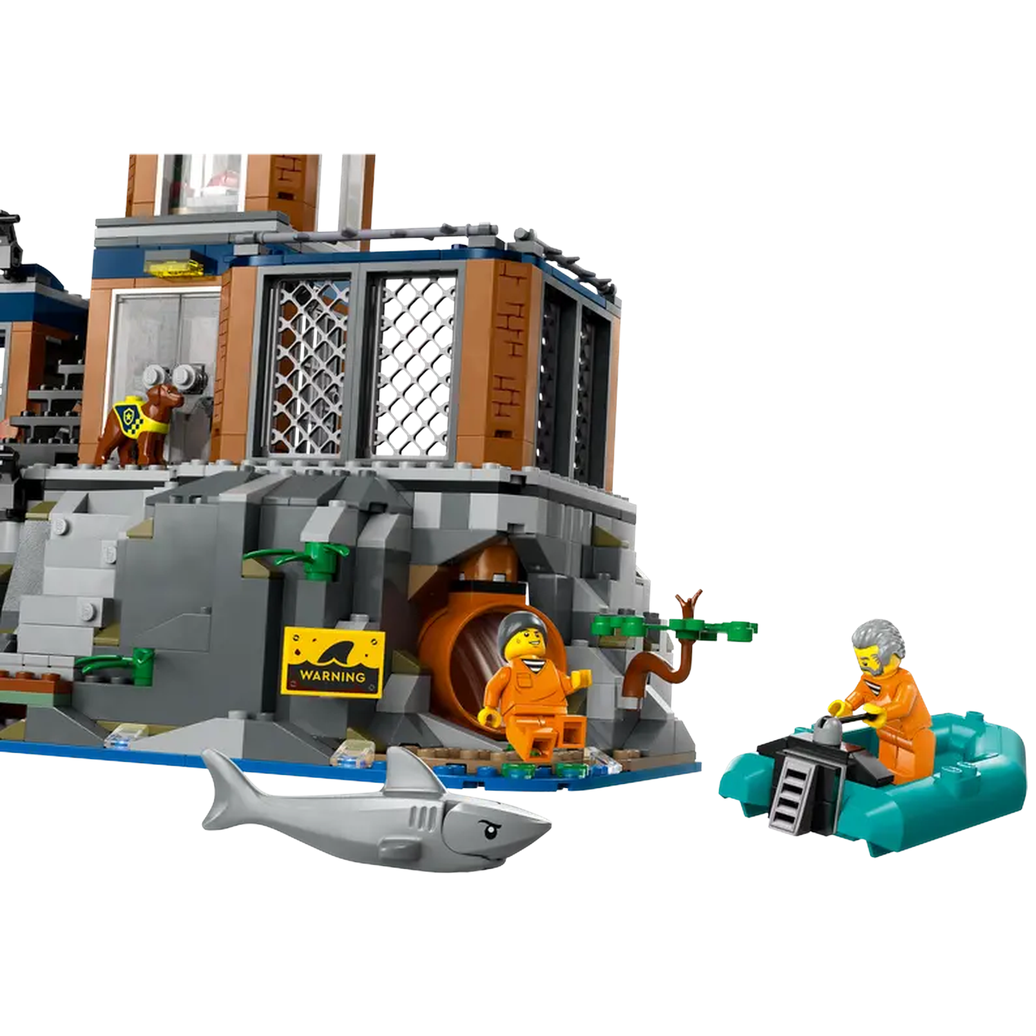 Lego set with a building, figures in orange suits, a shark, and a boat. A warning sign is present.