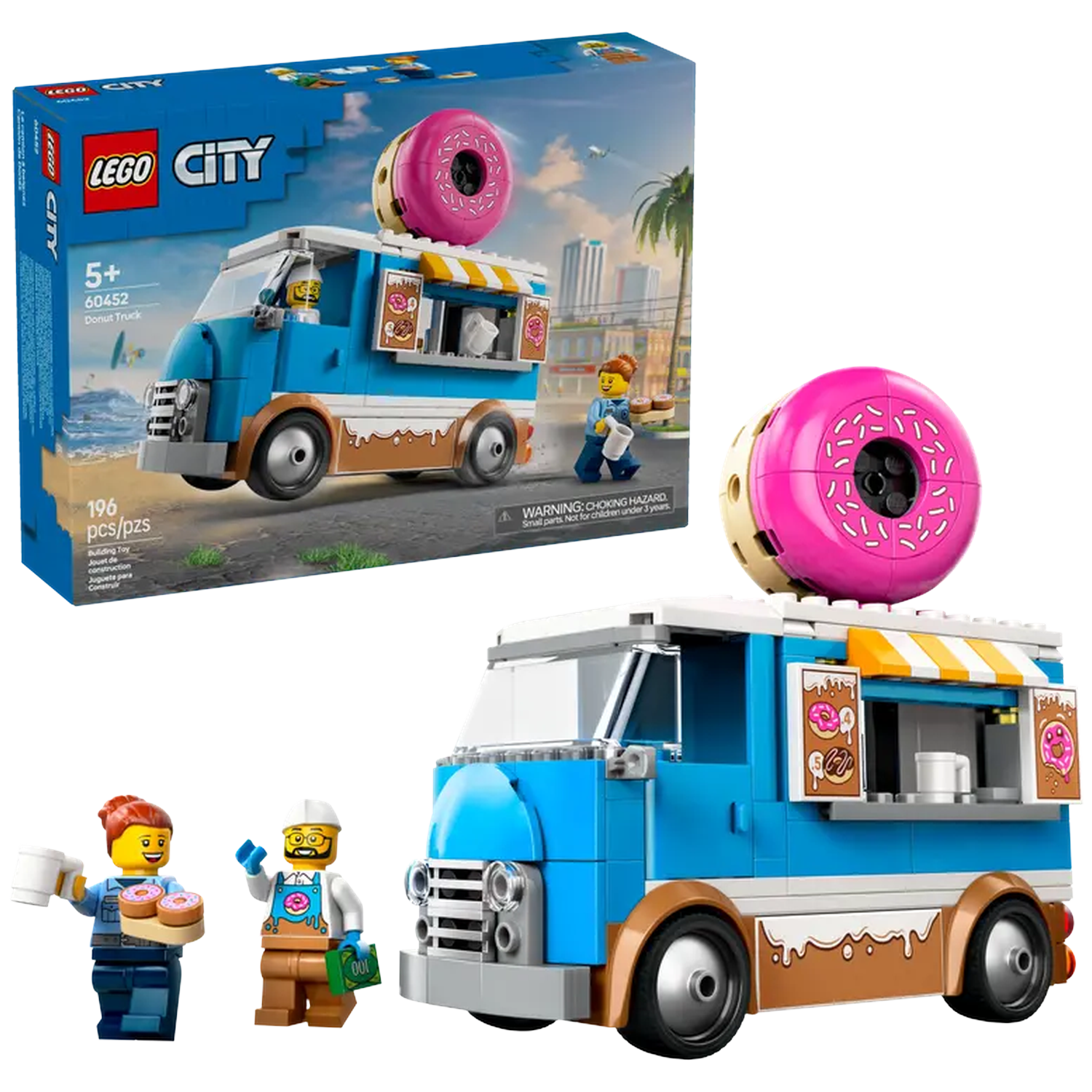 A Lego City donut truck set. It includes a blue and brown truck, mini-figures, and a large pink donut. The box is also visible.