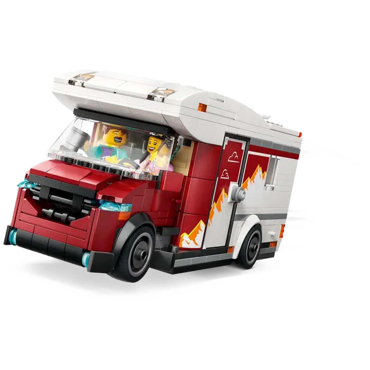 A Lego camper van, red and white, with two figures inside. The van is in motion with a white trail behind it.