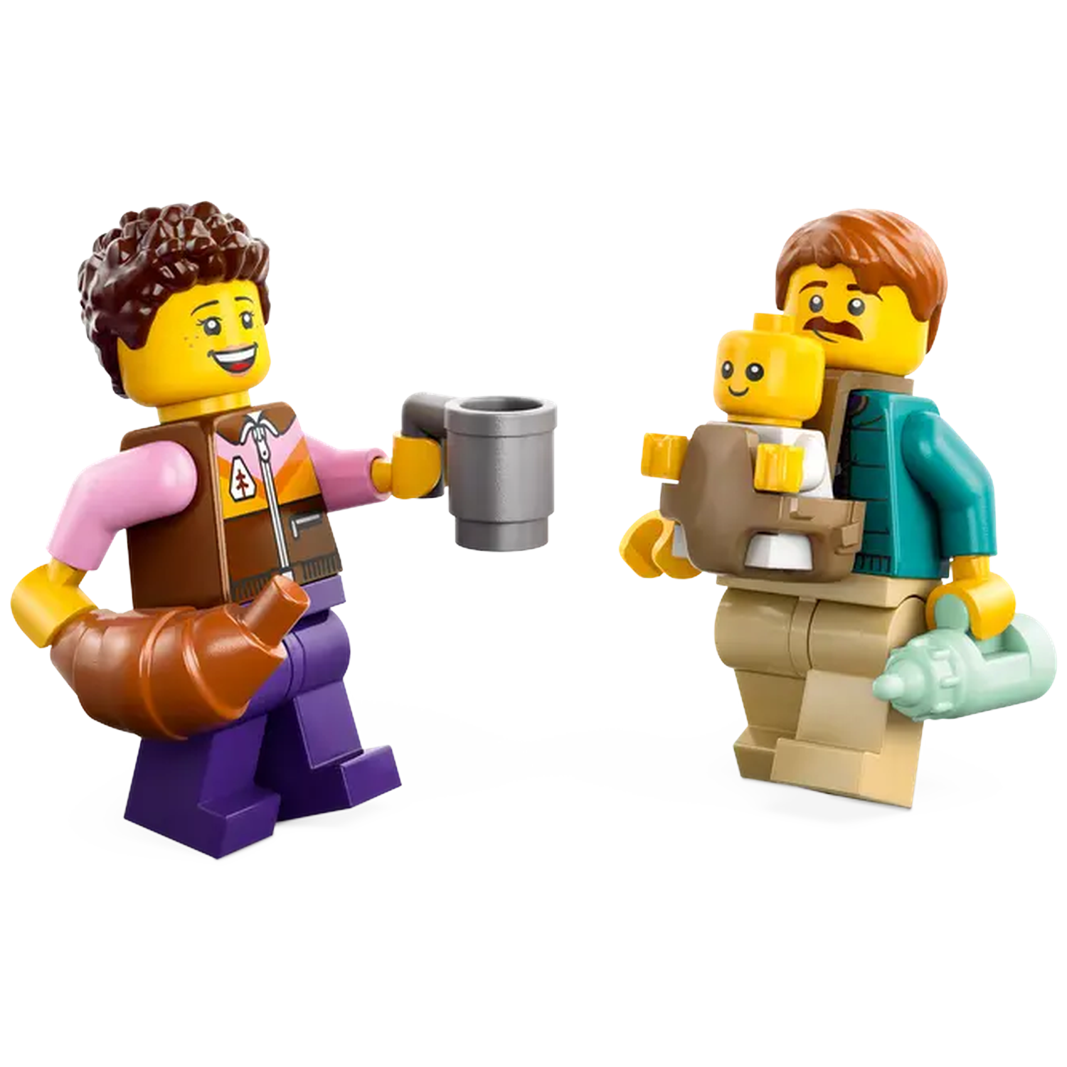 Lego figures: one with a mug and croissant, another carrying a baby. The baby is in a carrier, and the man holds a bottle.