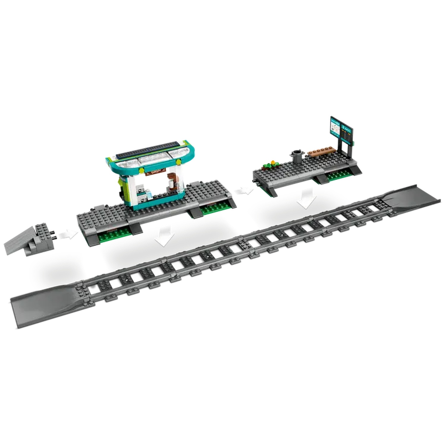 A Lego train station set. The set includes a station building, platform, train tracks, and a digital display screen. All of these are grey.
