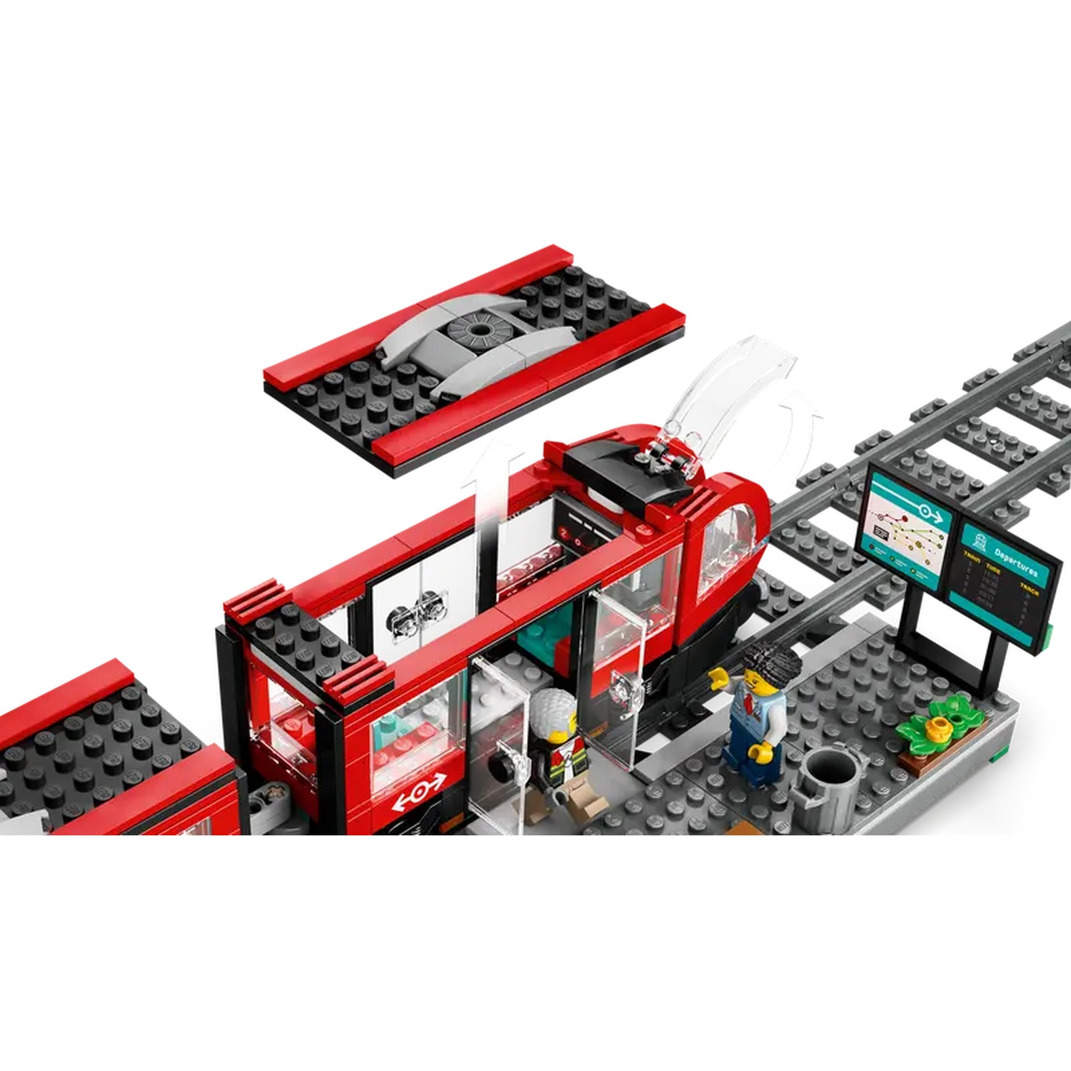 A Lego train set is shown with red train cars, a track, and miniature figures. The scene includes a station display.