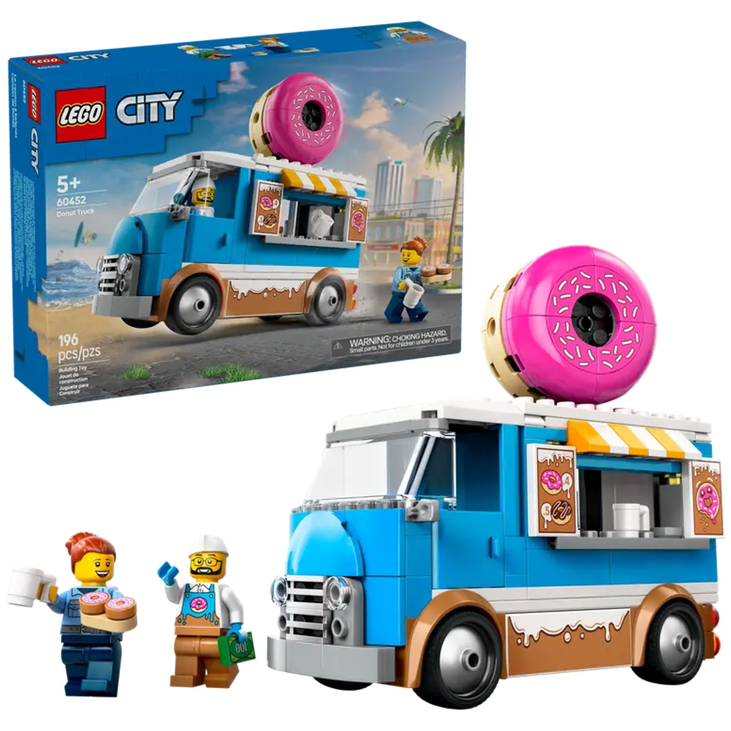 Een Lego City donut truck set met een roze donut erop. Inclusief minifiguren en de doos. De truck is blauw en bruin.