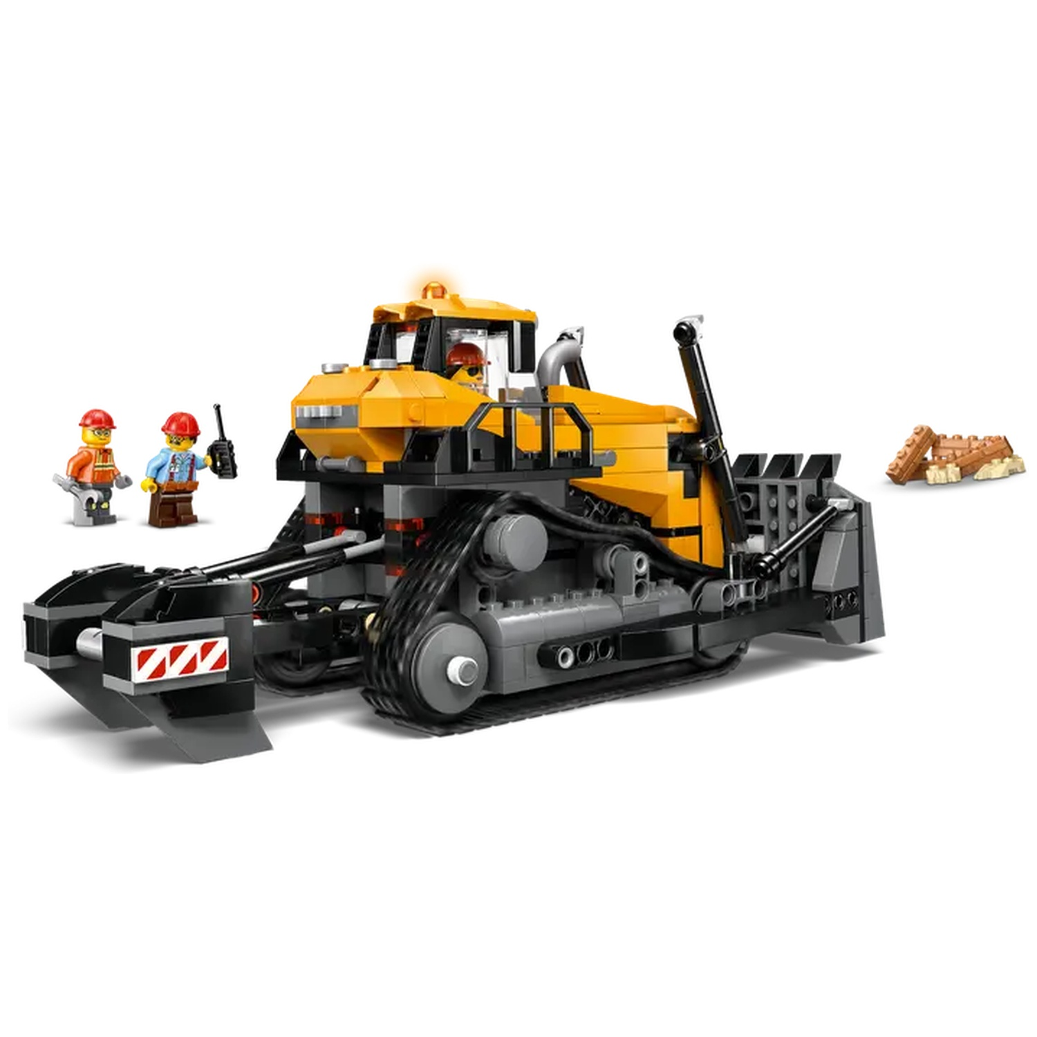 A yellow and black Lego bulldozer with a driver and two workers. A small pile of brown Lego bricks is on the right.