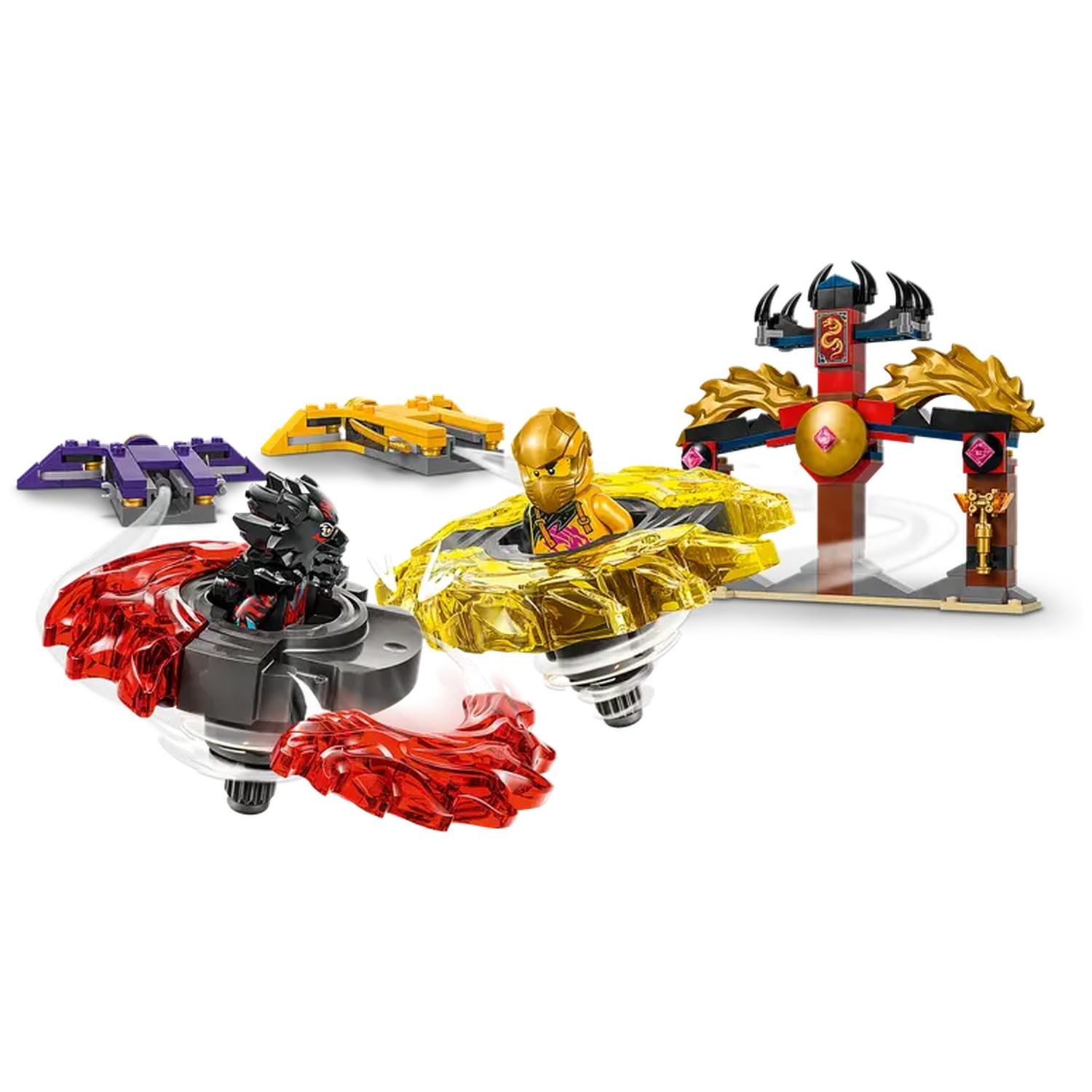Lego set with spinning tops in red, black, and yellow. A golden figure is inside a yellow one. A temple structure is in the background.