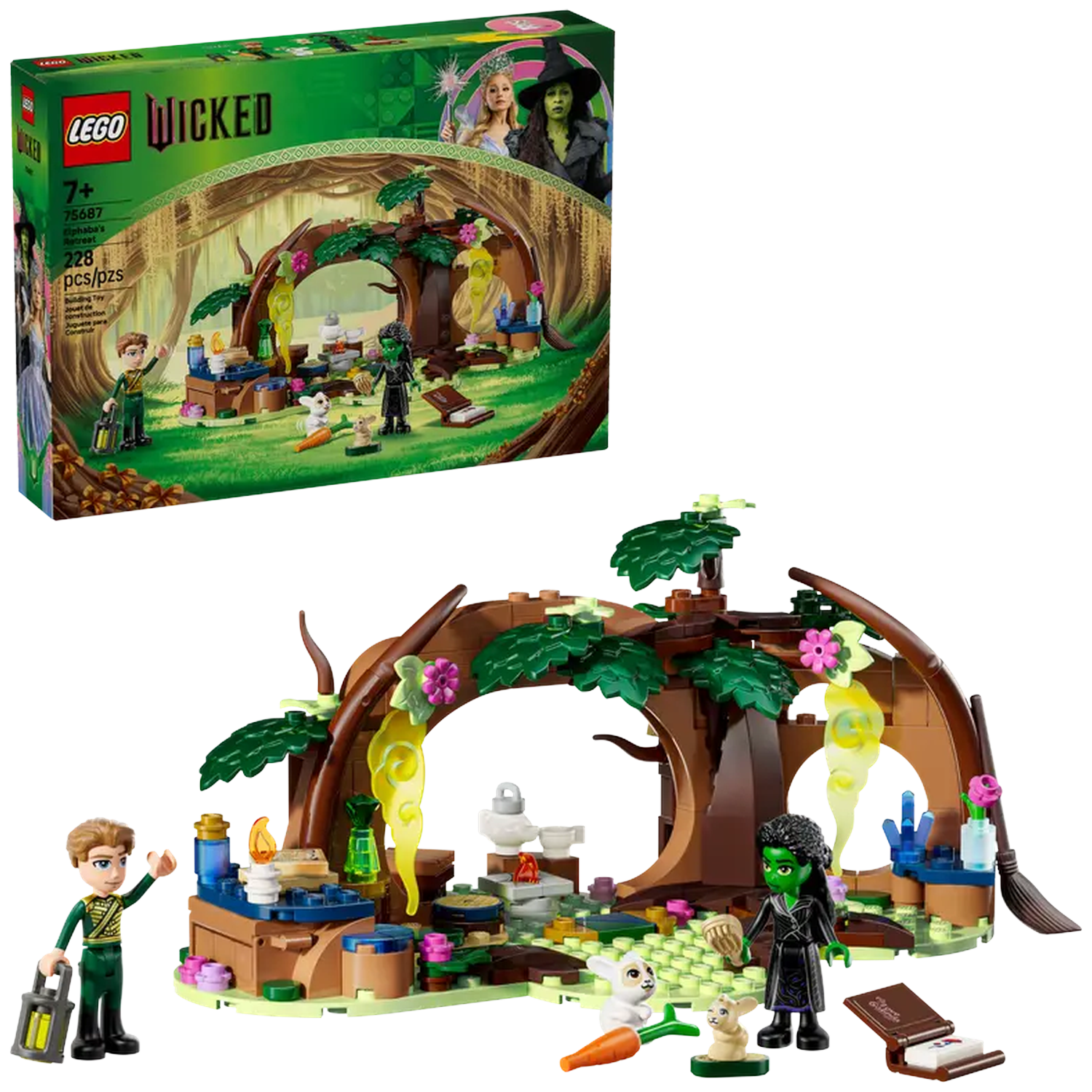 Lego set of Wicked scene. Includes figures of Elphaba, Glinda, and a man. The set has a brown arch, tree, and accessories.