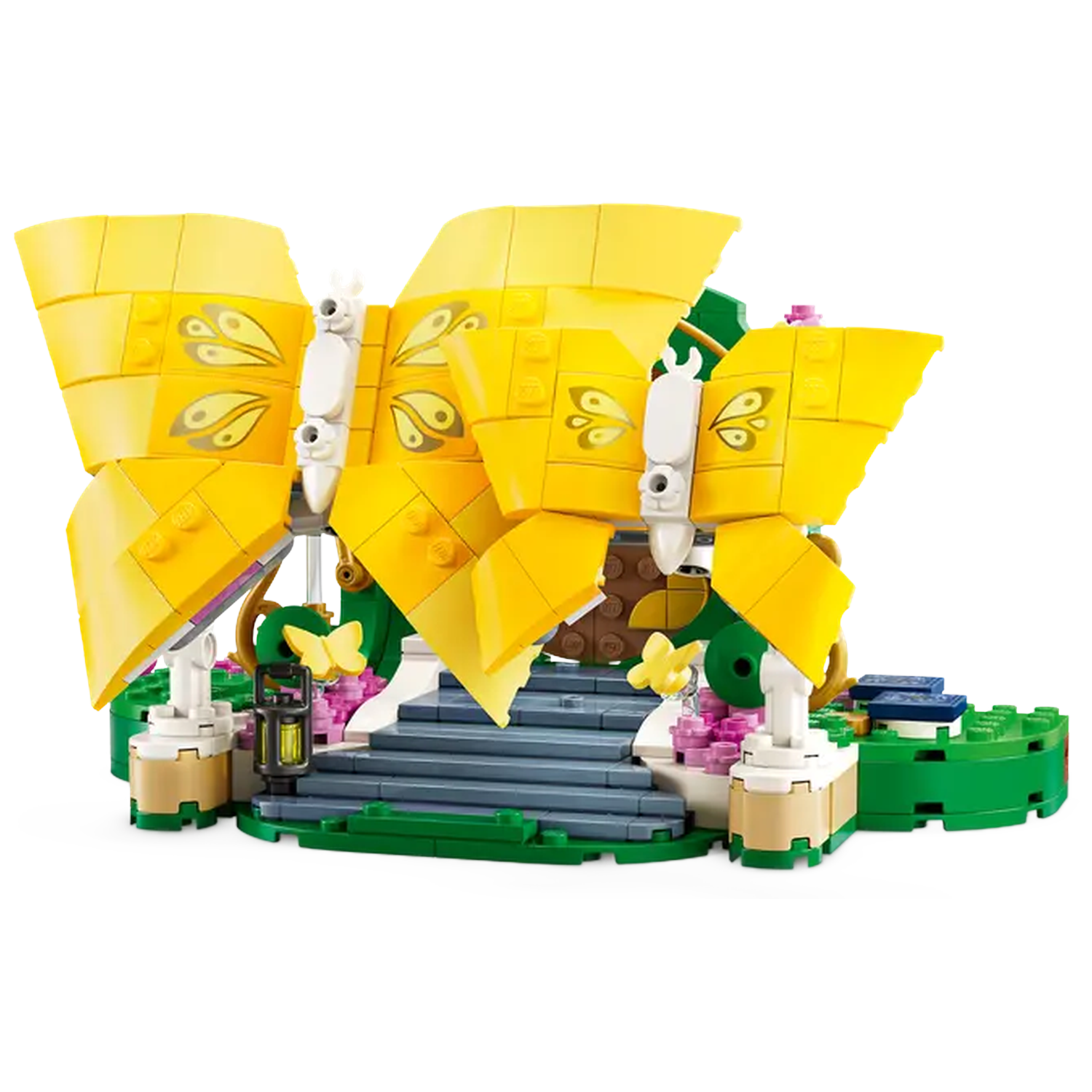 A Lego set of a yellow butterfly structure with a white base, green and brown accents, and a staircase. The background is white.