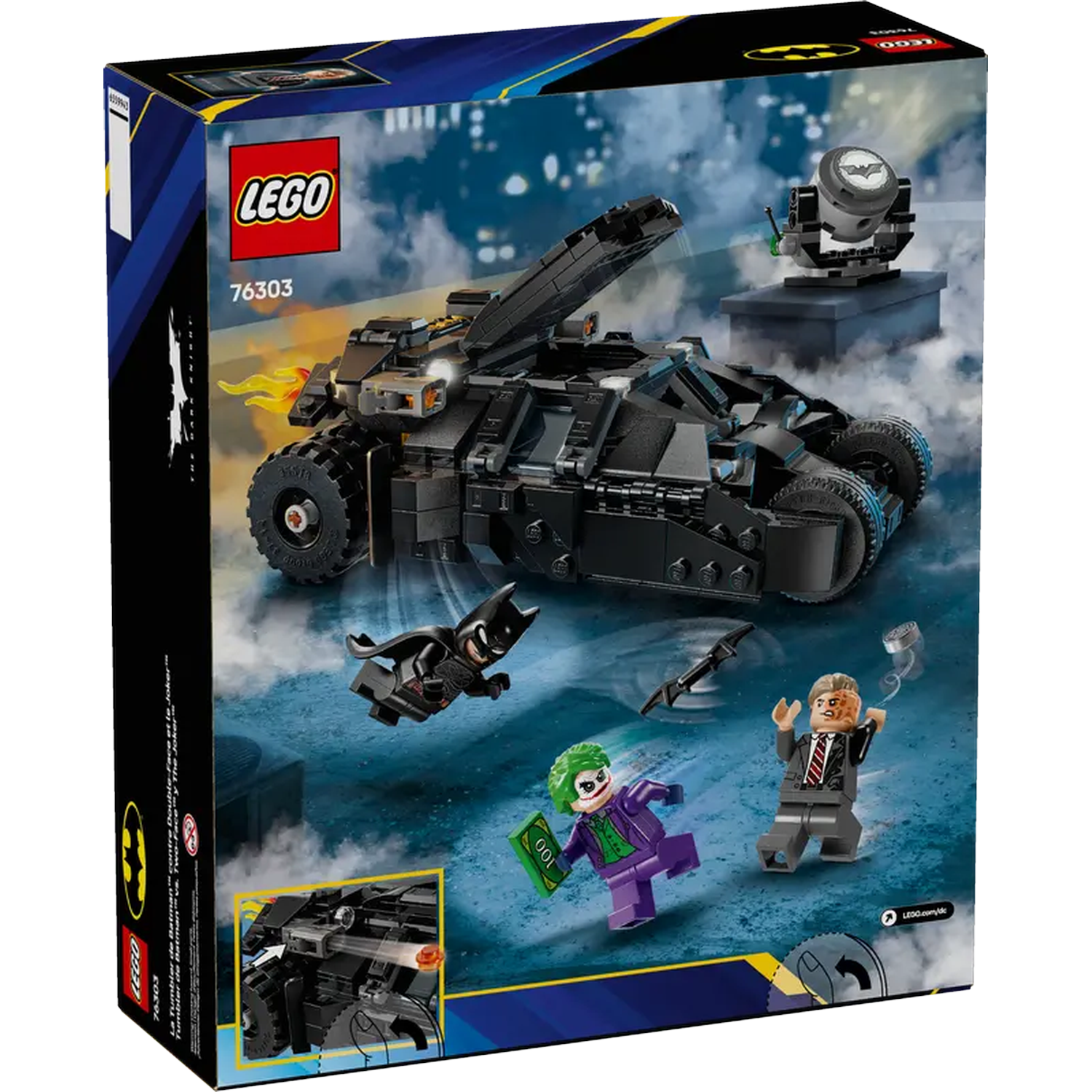 Lego box set featuring a black Tumbler, Batman, Joker, and Two-Face minifigures. Background has a Bat-Signal and cloudy sky.