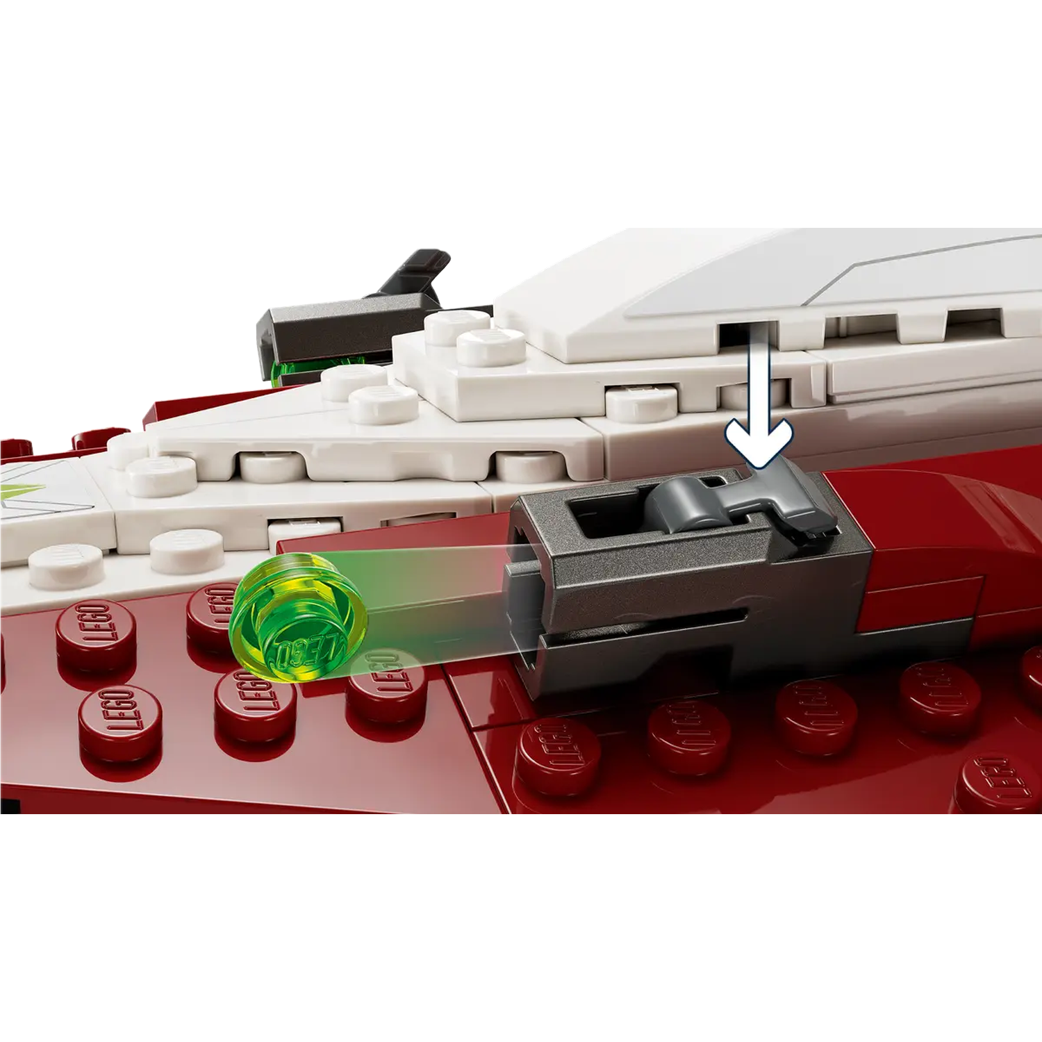 A Lego set. A green transparent projectile is being fired from a red and white Lego structure. Arrow indicates action.