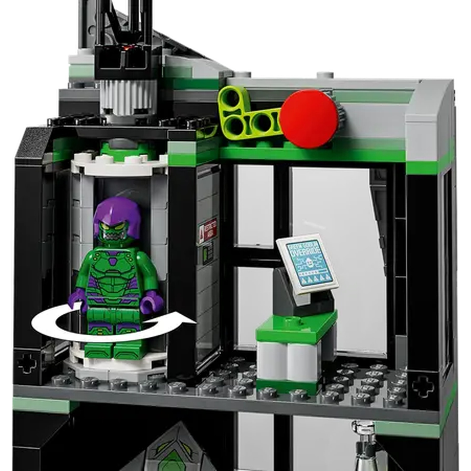 A Lego set featuring a Green Goblin figure. The figure stands in a cylindrical chamber. The set has green, grey, and black colors.