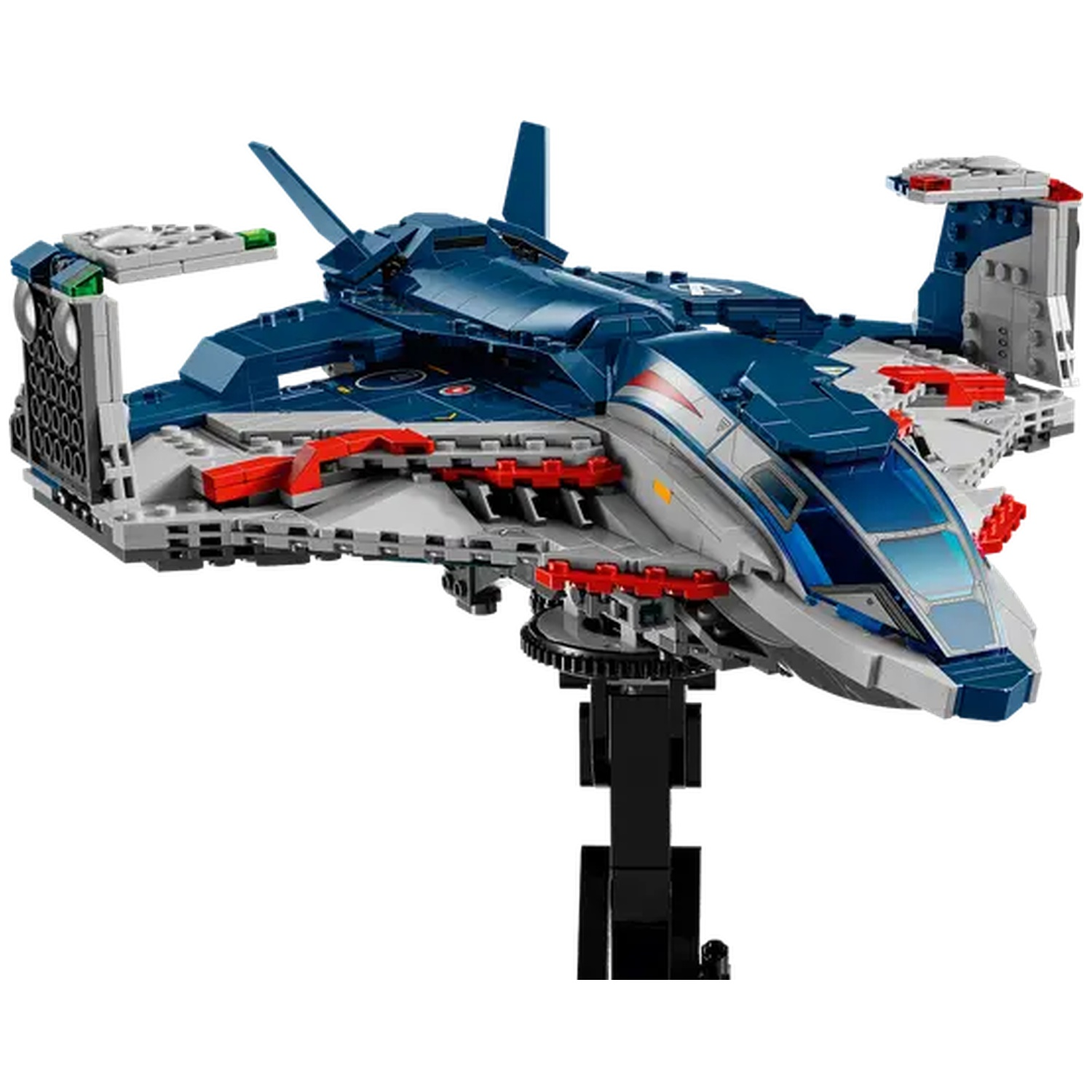 A Lego jet model, mostly blue, gray, and red, on a black stand. The jet has wings, cockpit, and tail fins, all detailed.
