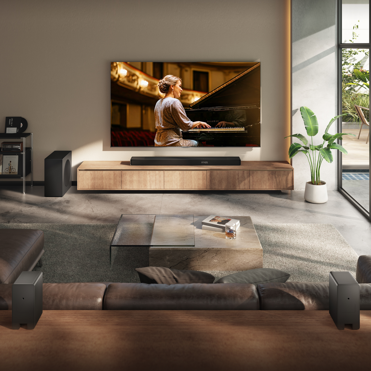 Living room with a large TV displaying a pianist. A soundbar is below the TV, and a sofa is in the foreground.