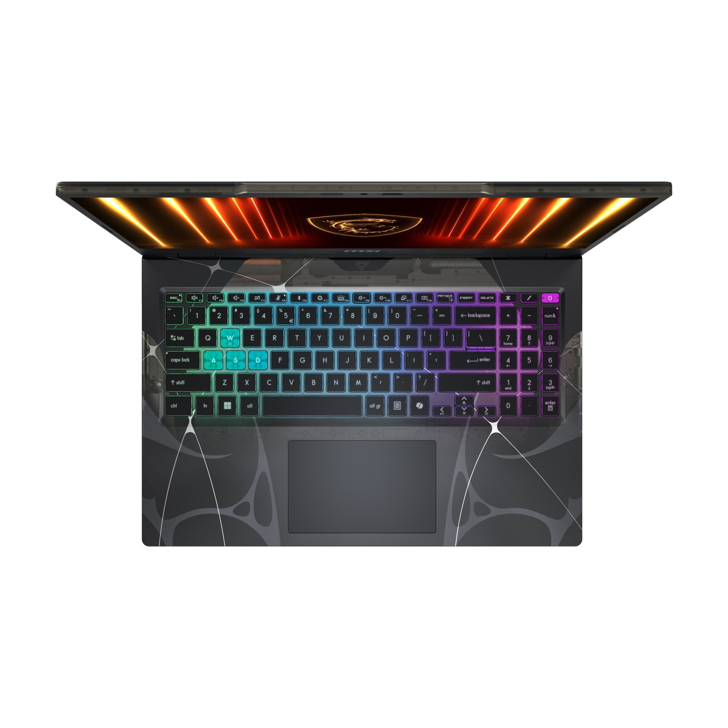 Laptop aperto, tastiera illuminata con vari colori. Lo schermo mostra un logo. Il laptop ha un motivo grigio scuro.