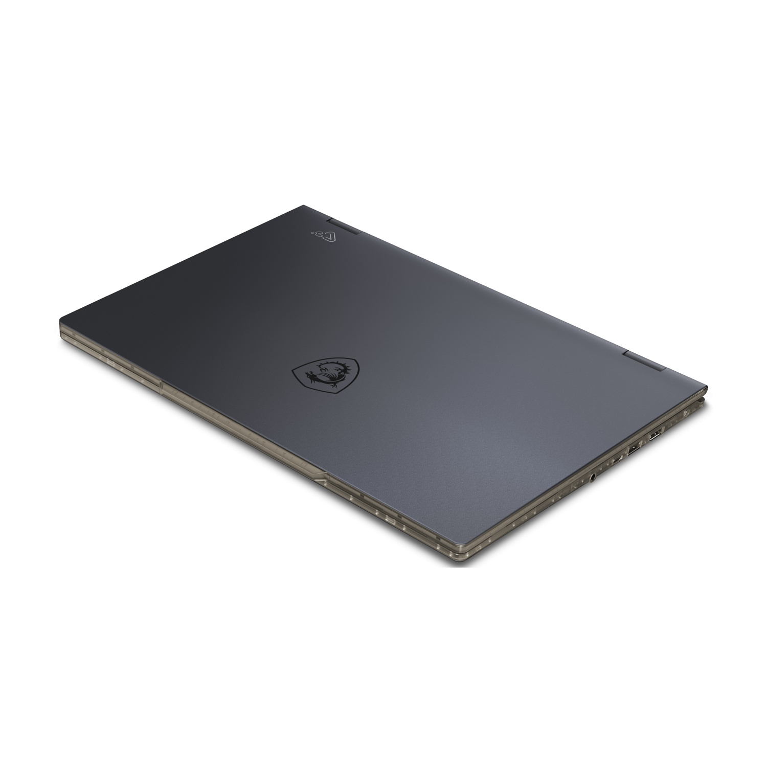 Un laptop grigio scuro chiuso su una superficie bianca. Il logo MSI è visibile. Il laptop è leggermente angolato.