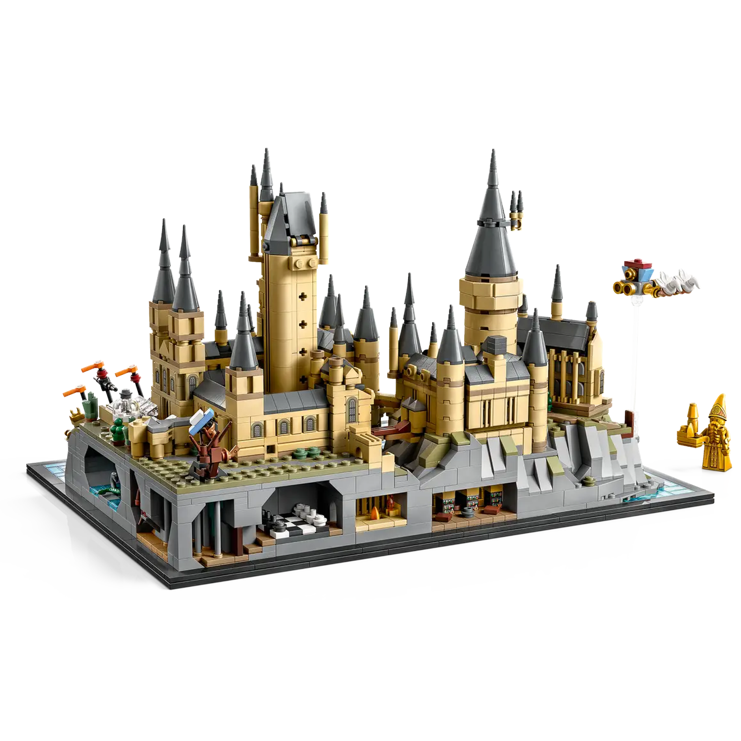 Lego Hogwarts castle model. Tan and grey, detailed structure. Includes mini-figures and flying carriage. Set on a black base.