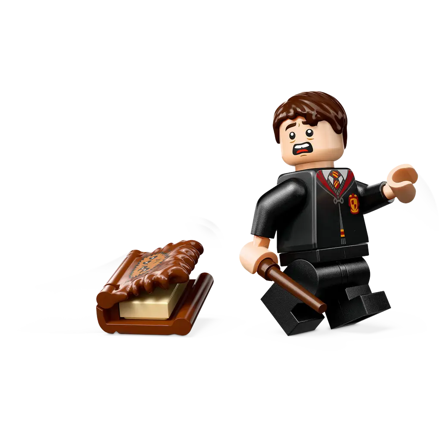 Lego figure of a boy in black robes with a wand, looking scared. A book is on the left.