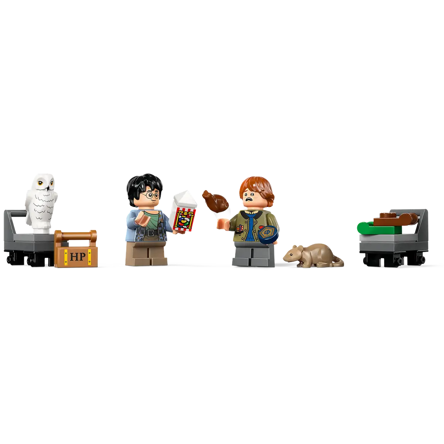 Lego Harry Potter set. Harry and Ron with owl, rat, and food carts. Harry holds popcorn. Ron holds chicken. White background.