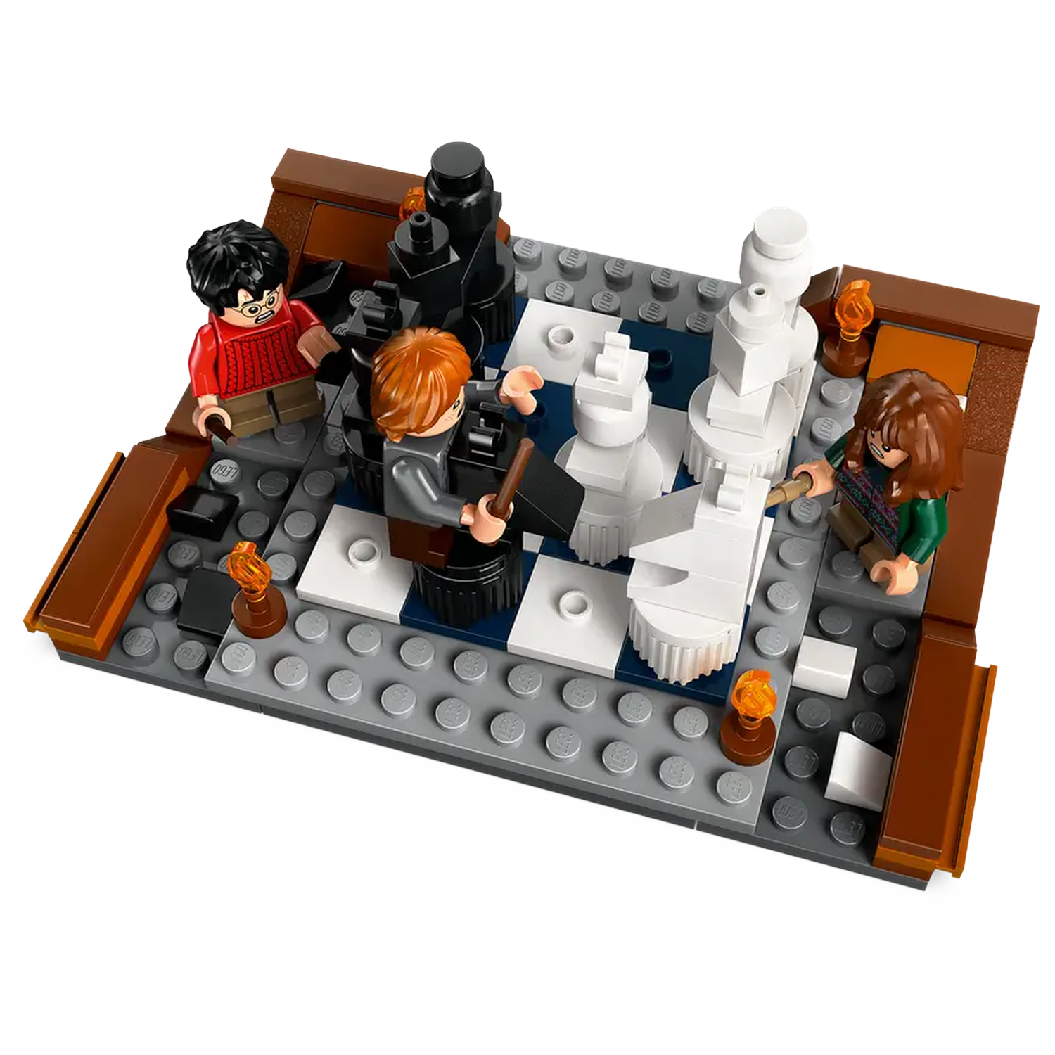 Lego set with three figures around a chess board. Harry Potter, Ron Weasley, and Hermione Granger. Chess pieces in white and black.
