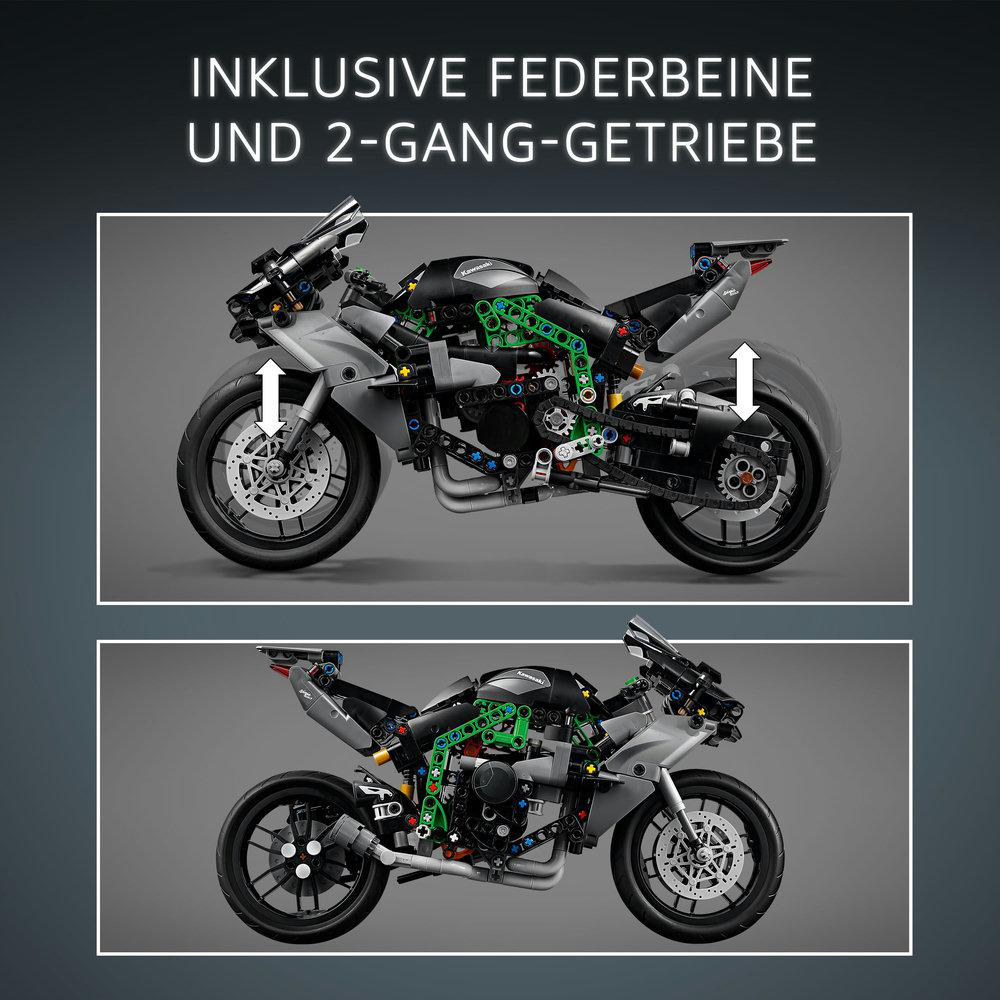 Zwei Bilder eines grauen und schwarzen Motorradmodells. Eines hat Pfeile, um Federung und Getriebe zu zeigen. Oben steht 'INCLUSIVE FEDERBEINE UND 2-GANG-GETRIEBE'.