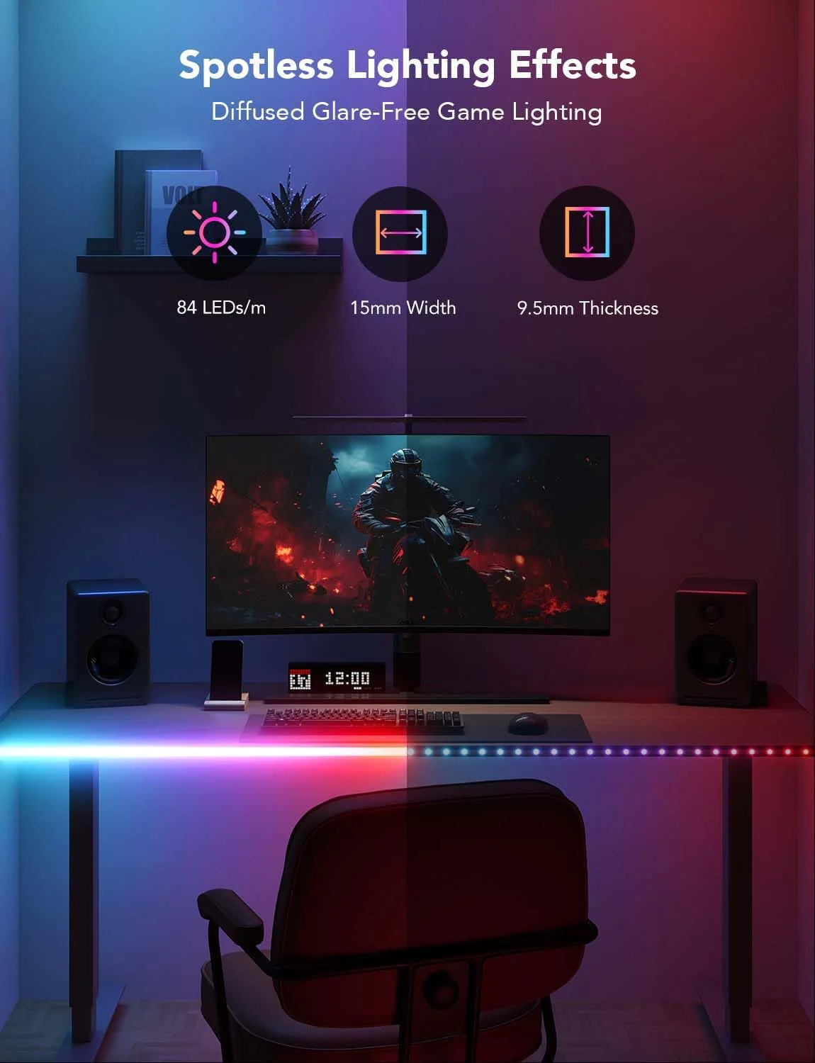 Egy játékbeállítás monitorral, hangszórókkal és asztallal, LED szalagokkal. Egy szék van az asztal előtt.