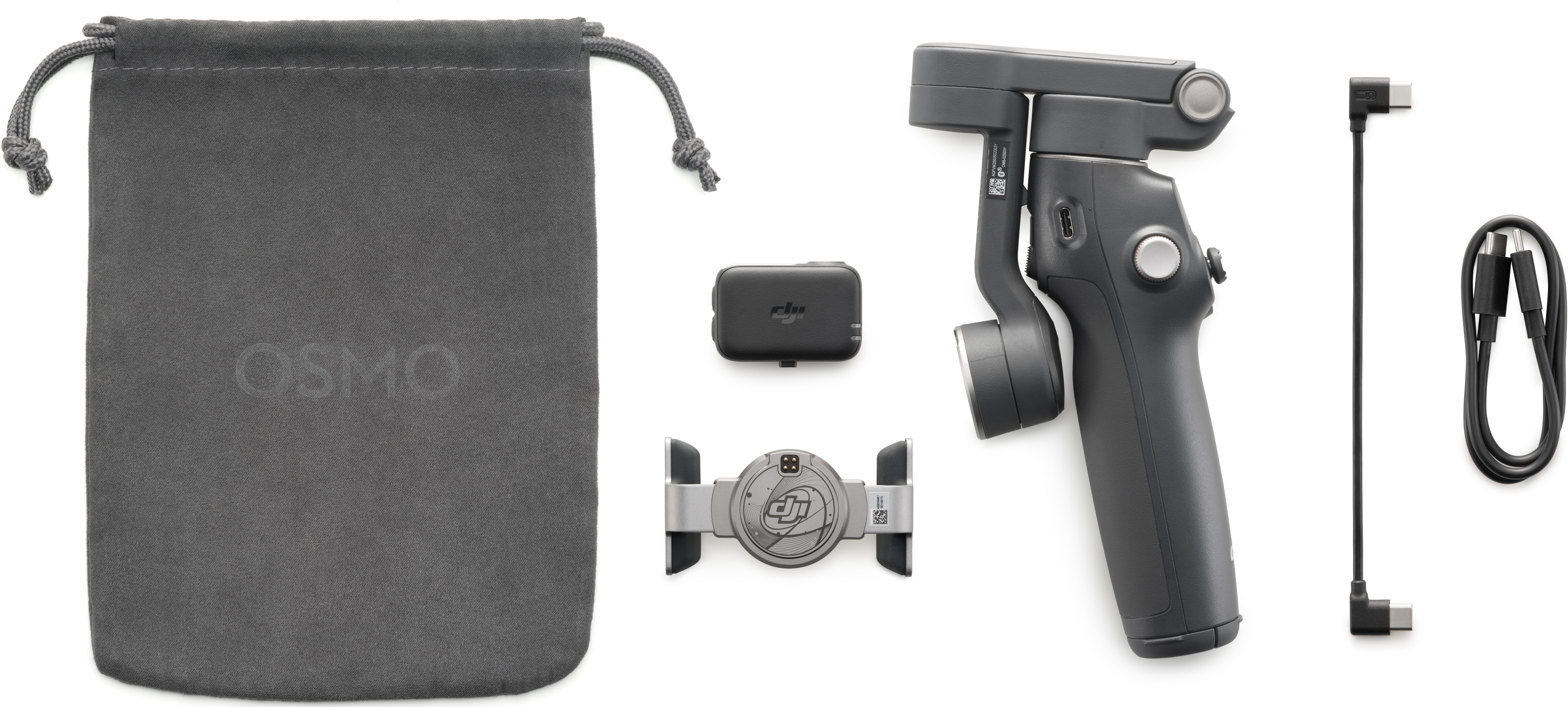Kit DJI Osmo su sfondo bianco. Include gimbal, borsa, microfono wireless e cavi. Tutti gli elementi sono grigi e neri.