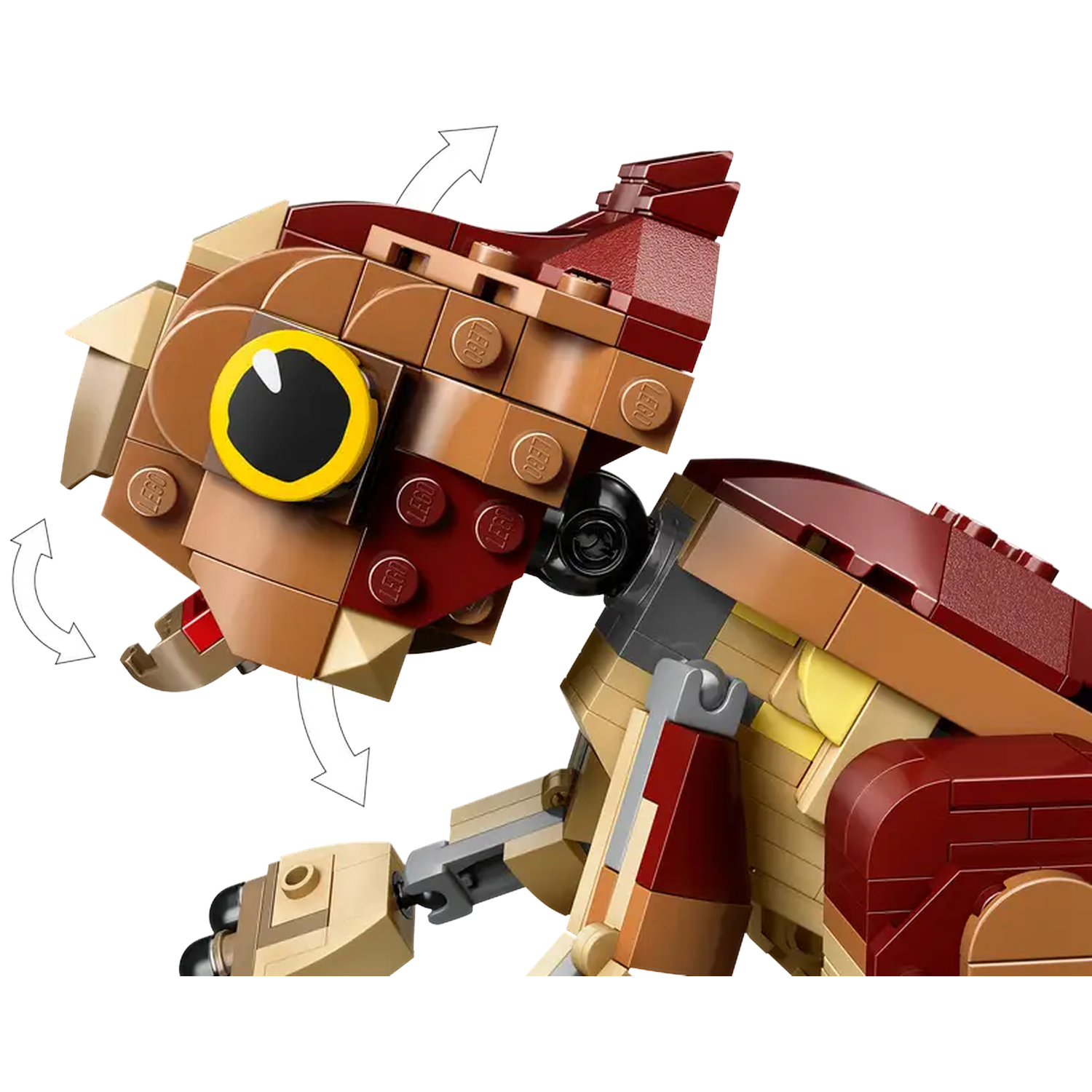 A Lego animal head made of brown, tan, and red blocks. It has a large yellow eye with a black pupil and a hinged jaw.
