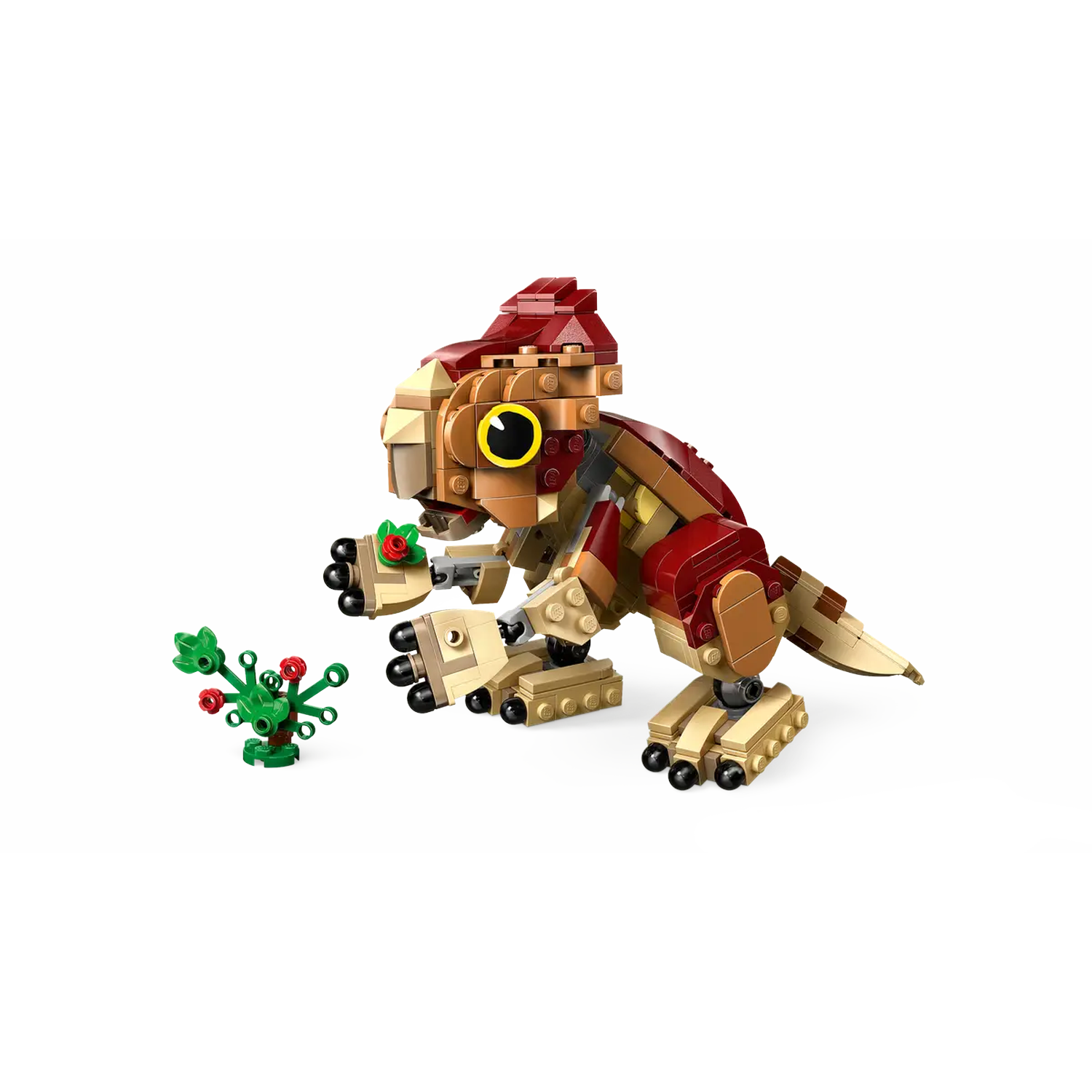 A Lego dinosaur with red and tan blocks eating a plant with red berries. White background.