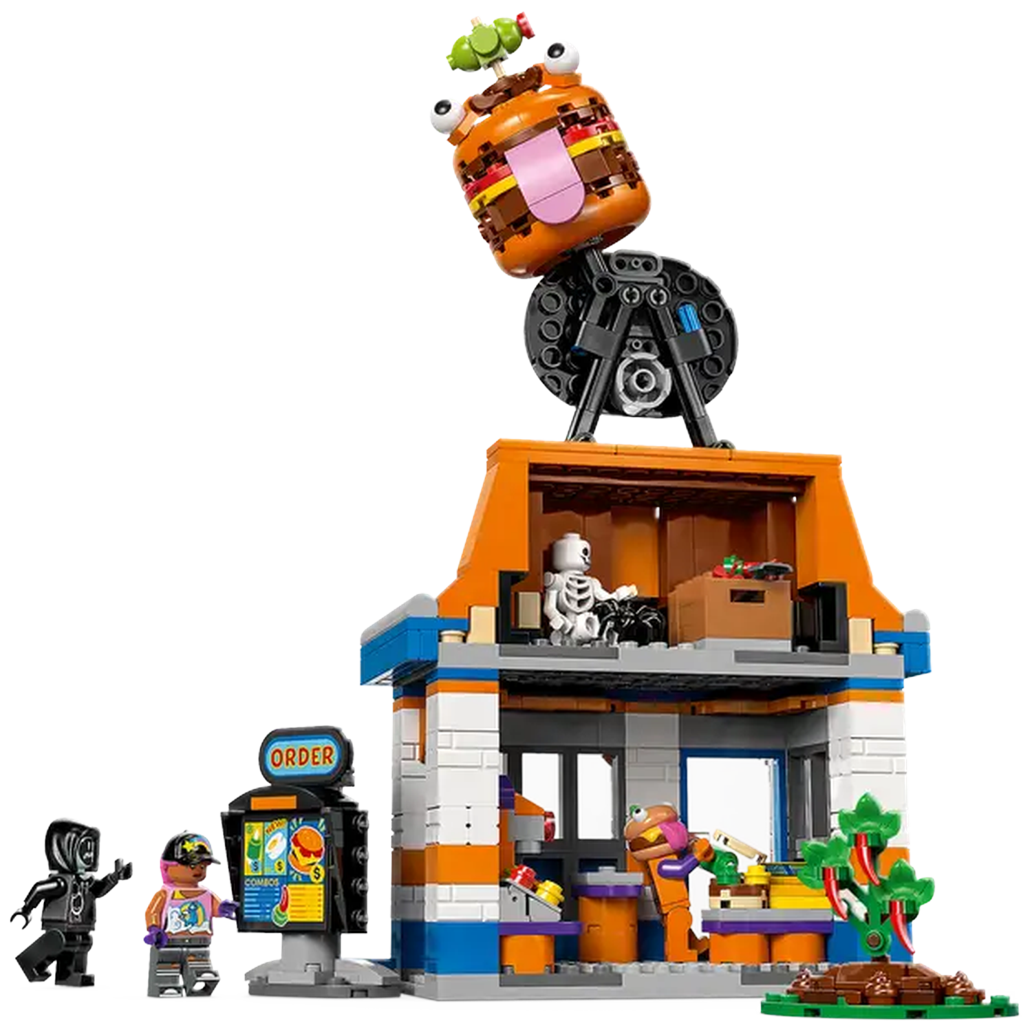 Legoset met een hamburgerrestaurant. Een gigantische burgerkop staat bovenop het gebouw. Minifiguren staan voor het restaurant.