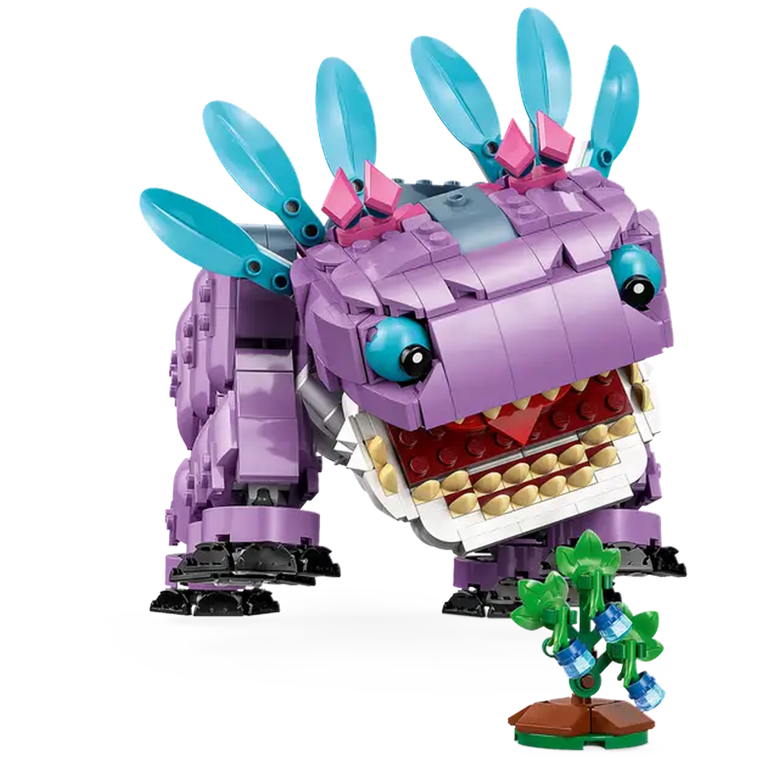Een Lego-wezen in paars en blauwgroen. Het heeft een wijd open mond en een kleine plant ervoor. Witte achtergrond.
