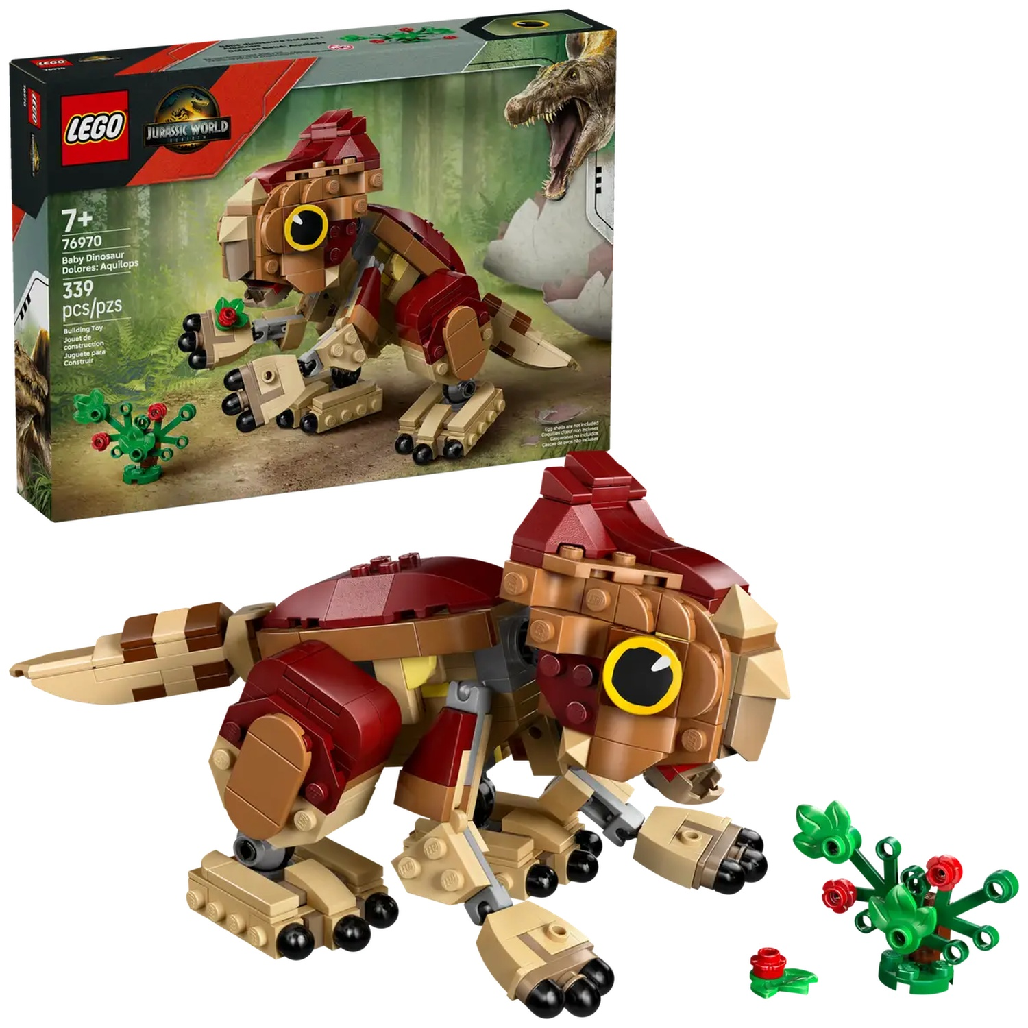 A Lego baby dinosaur model with a box in the background. The dinosaur is brown and red with yellow eyes. There are also green plants.